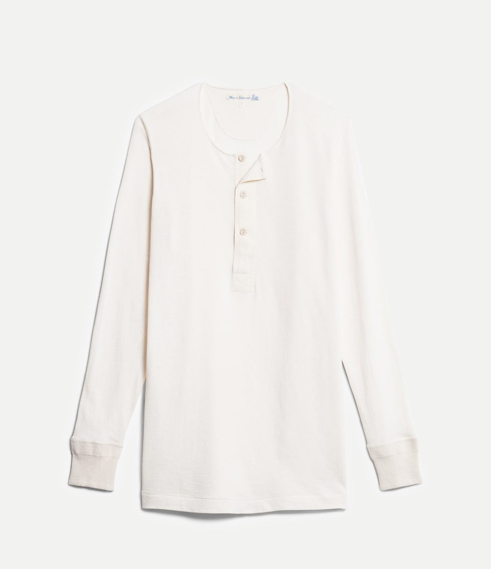 White long-sleeve shirt on a light gray background