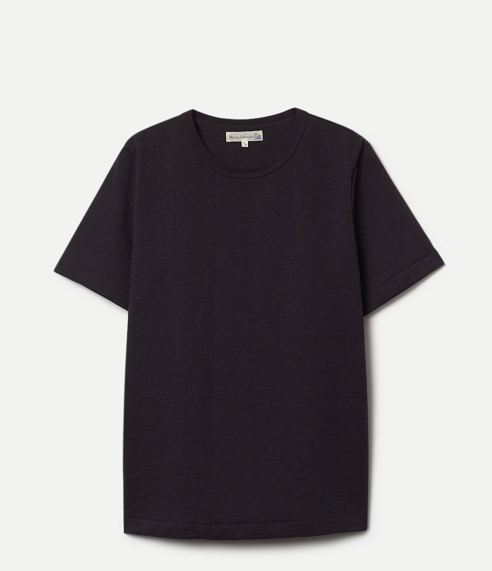 Black t-shirt on a light gray background
