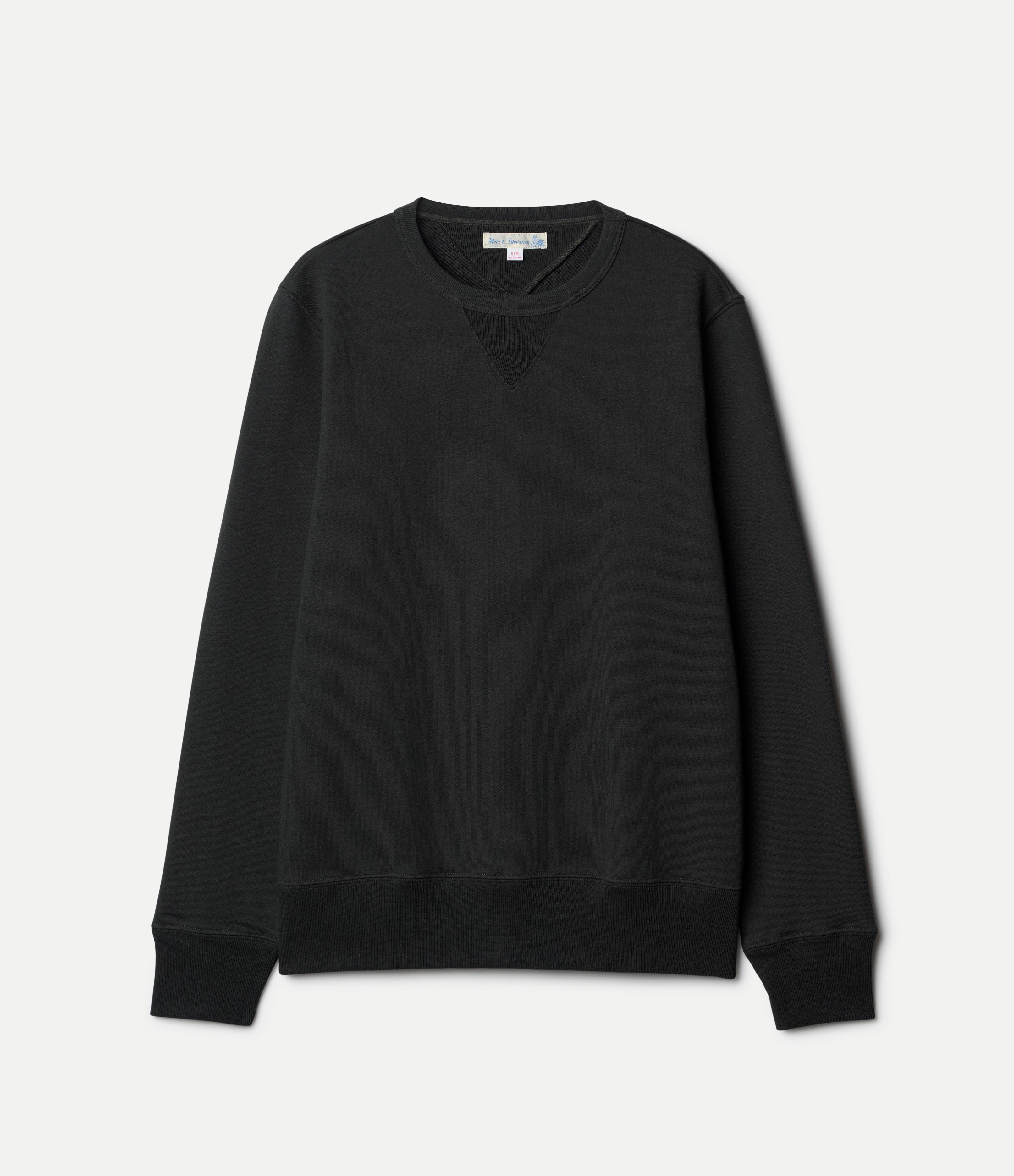 green sweatshirt on a light gray background