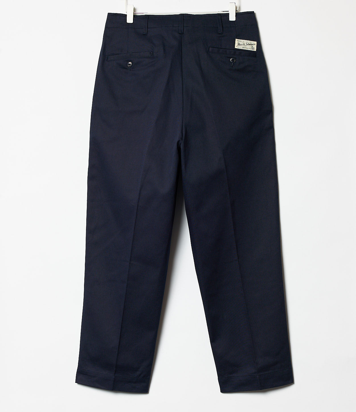 Navy pants with a brand label on a white background