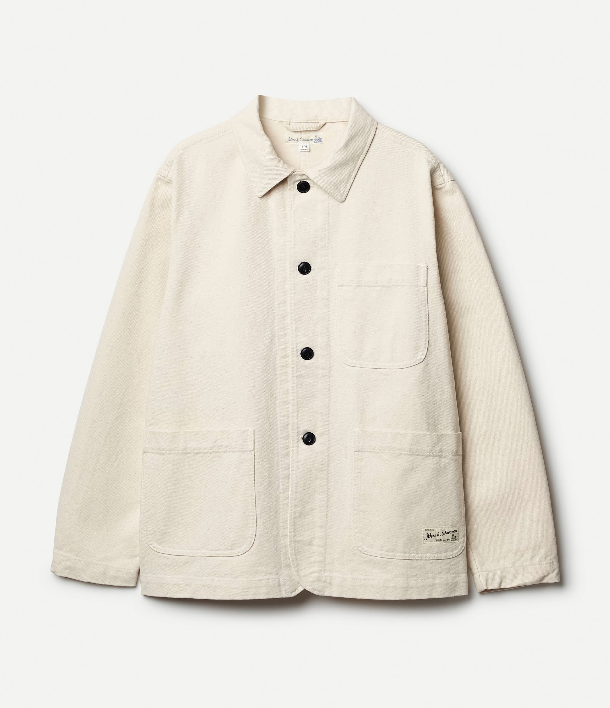 Beige cotton twill jacket agains neutral background