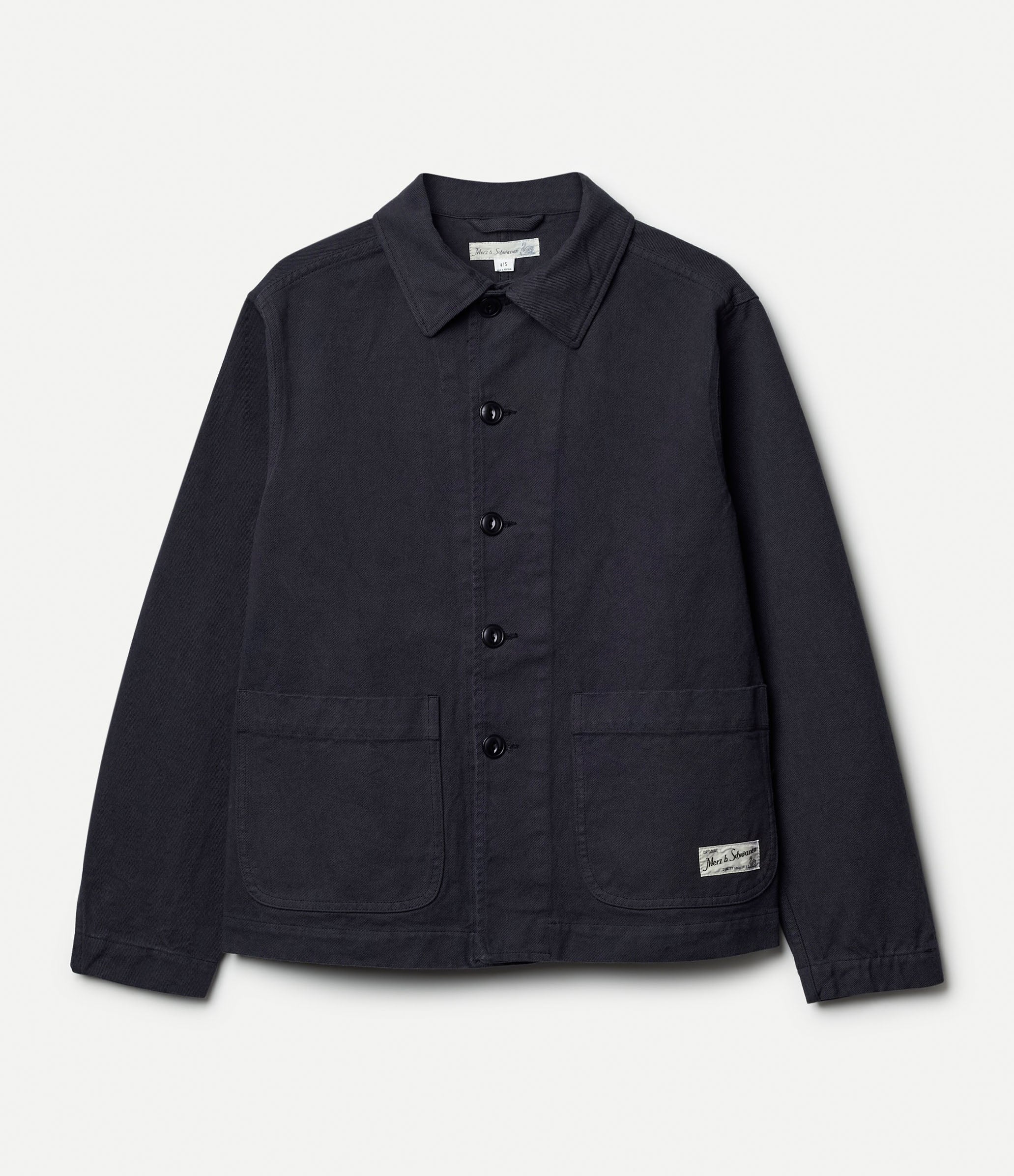 Dark grey cotton twill jacket against neutral background
