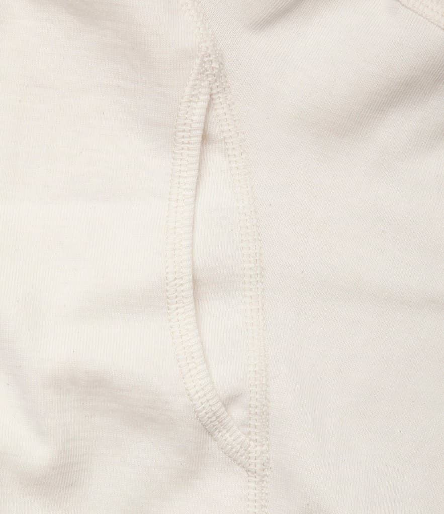 Close-up of a beige boxer brief with a soft waistband, made of organic cotton fabric.