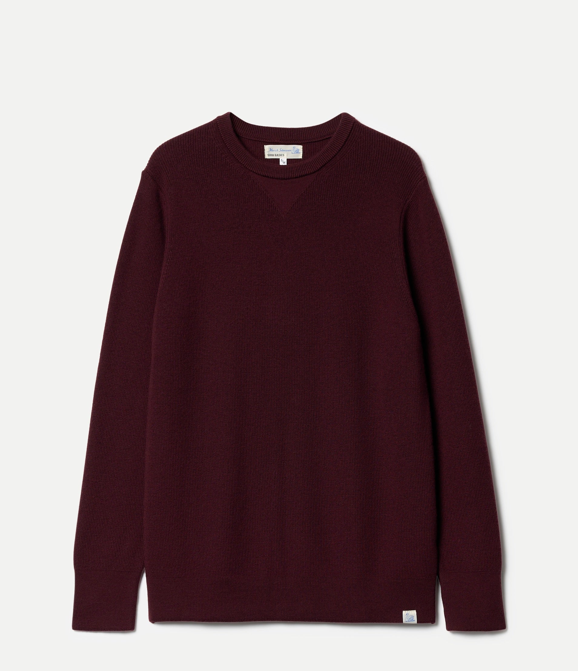 Maroon sweater on a light gray background