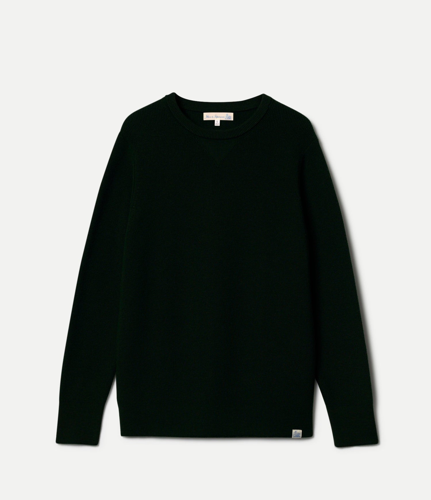 Black merino wool sweater on a light gray background