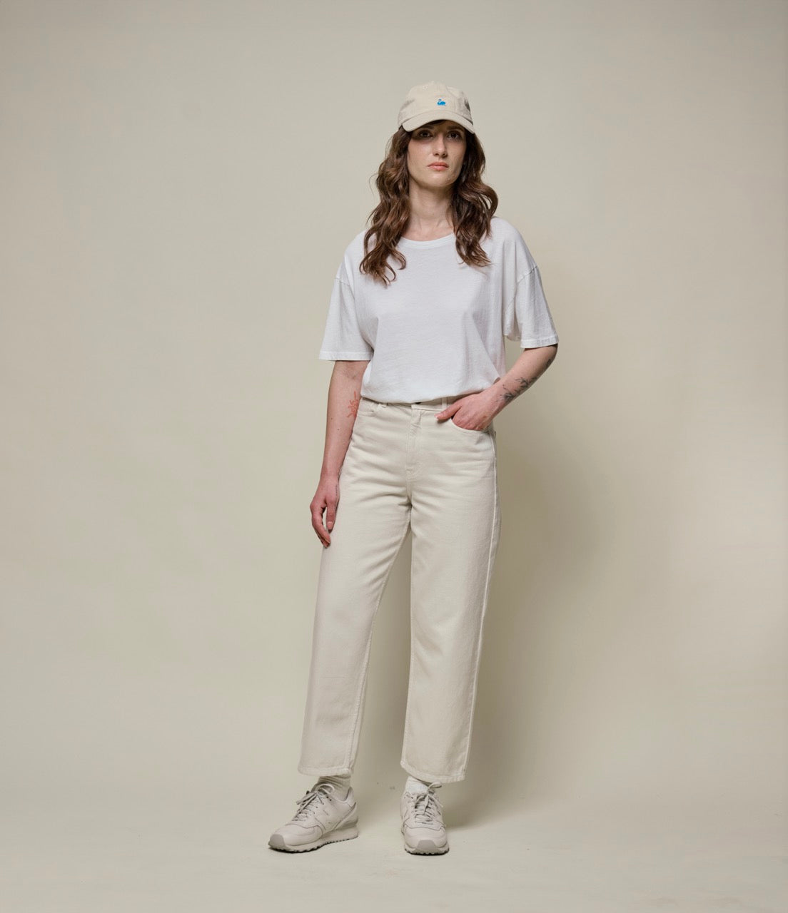 Person wearing beige cotton twill pants and white T-shirt