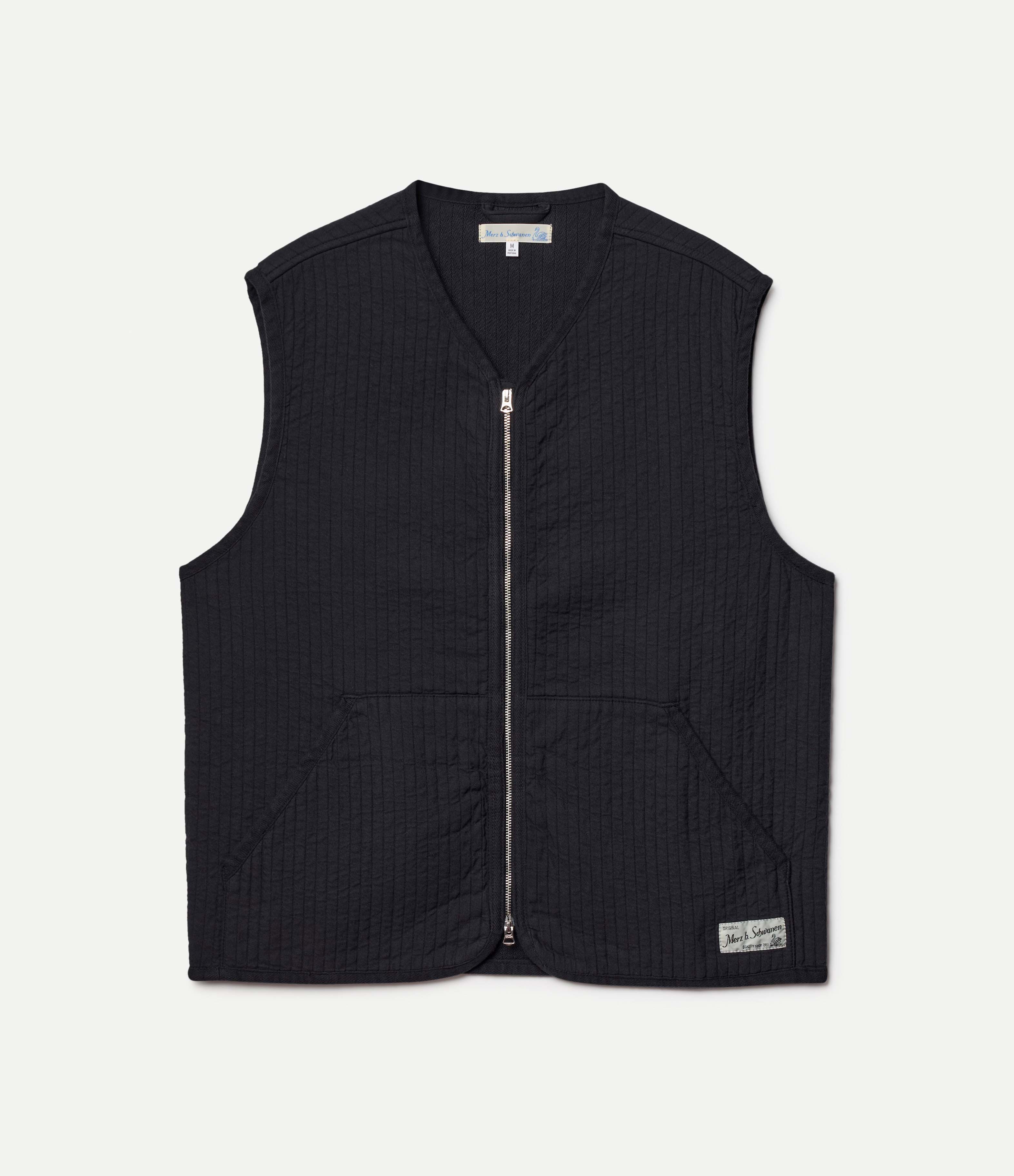 Black padded vest on a white background