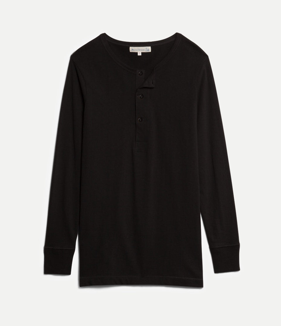Black long-sleeve shirt with buttons on a light gray background