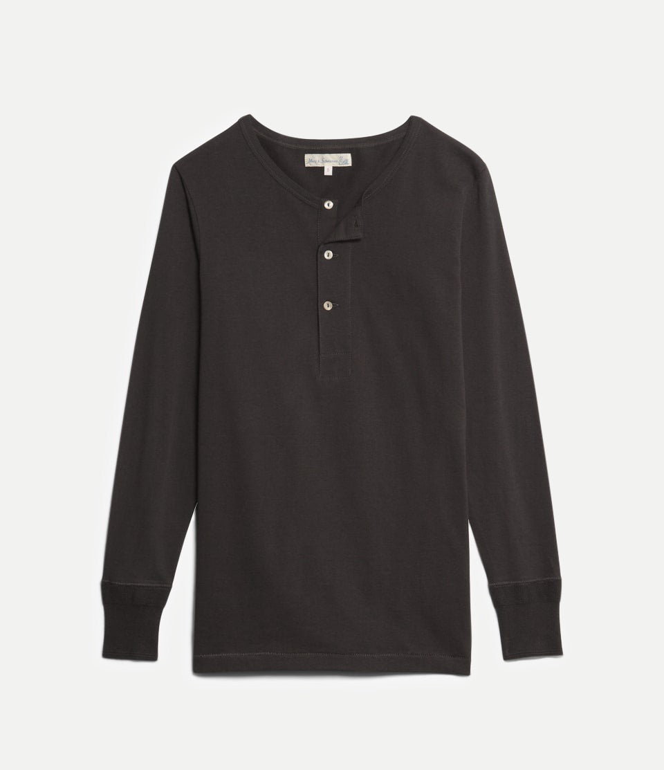 Black long-sleeve henley shirt on a light gray background
