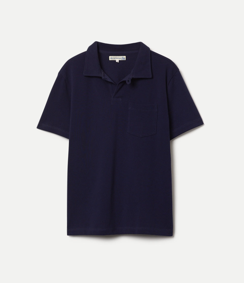 Navy loopwheeled pikee polo shirt on a light gray background