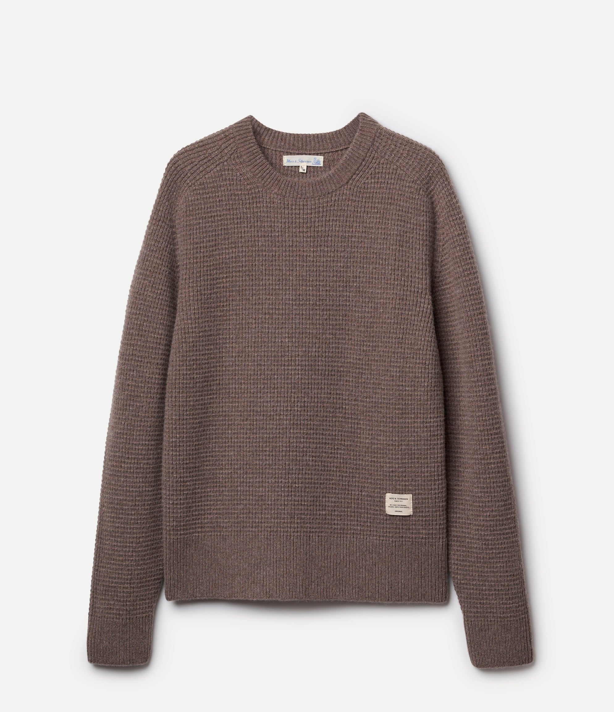 Brown textured sweater on a light gray background