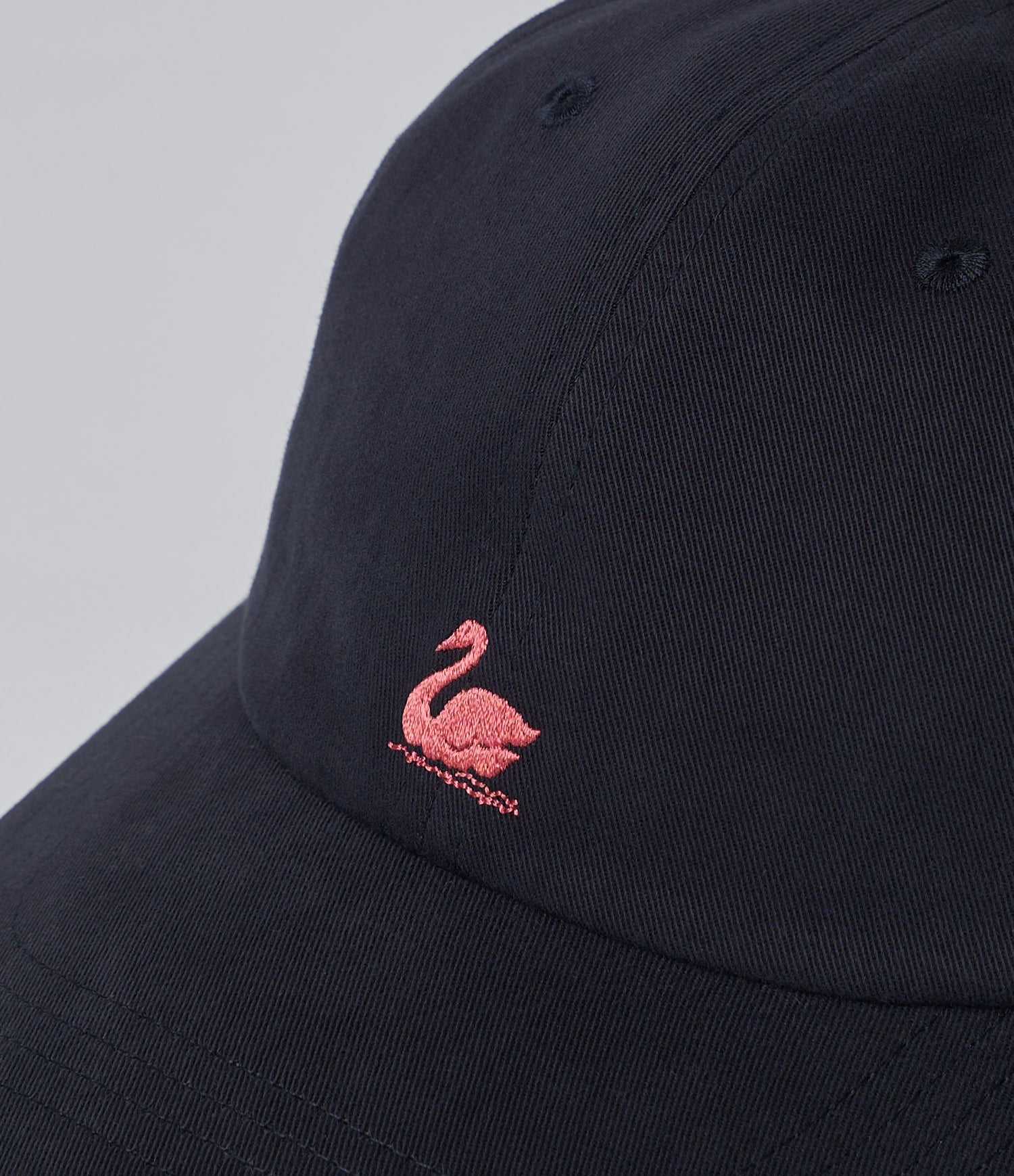 Charcoal cap with an ambroidered swan logo