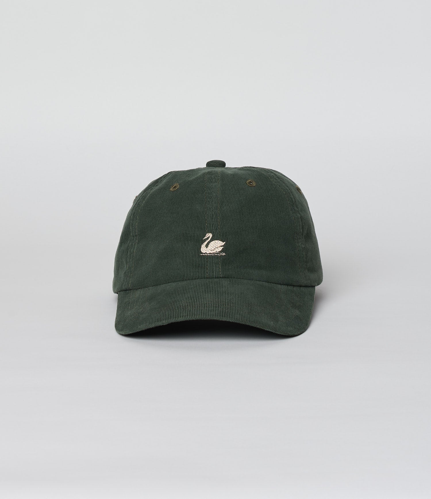 Green corduroy cap with a logo on a light gray background