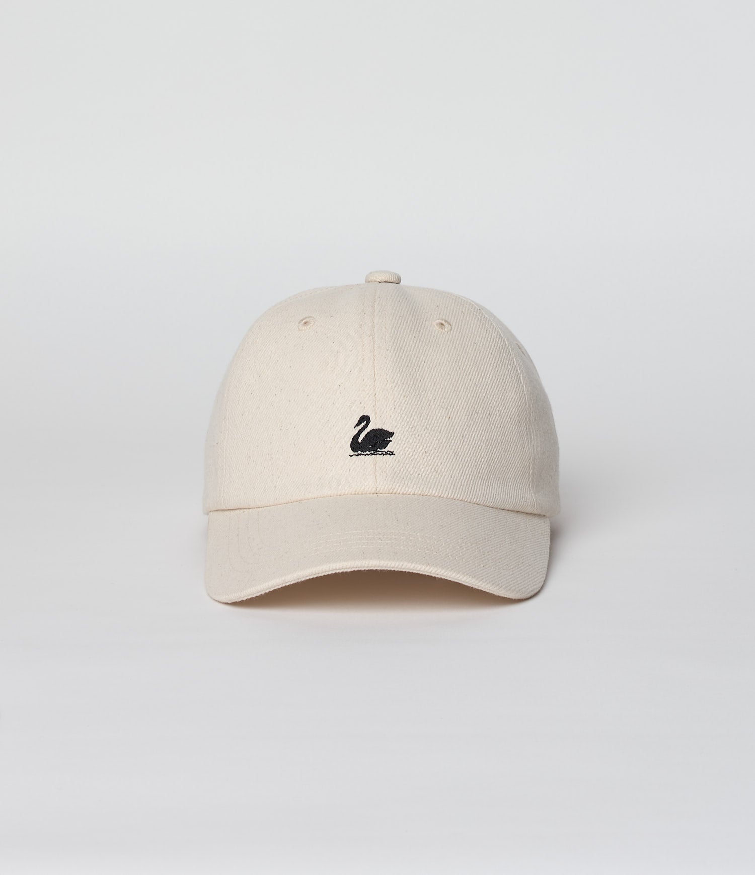 Beige cap with a black logo on a light gray background