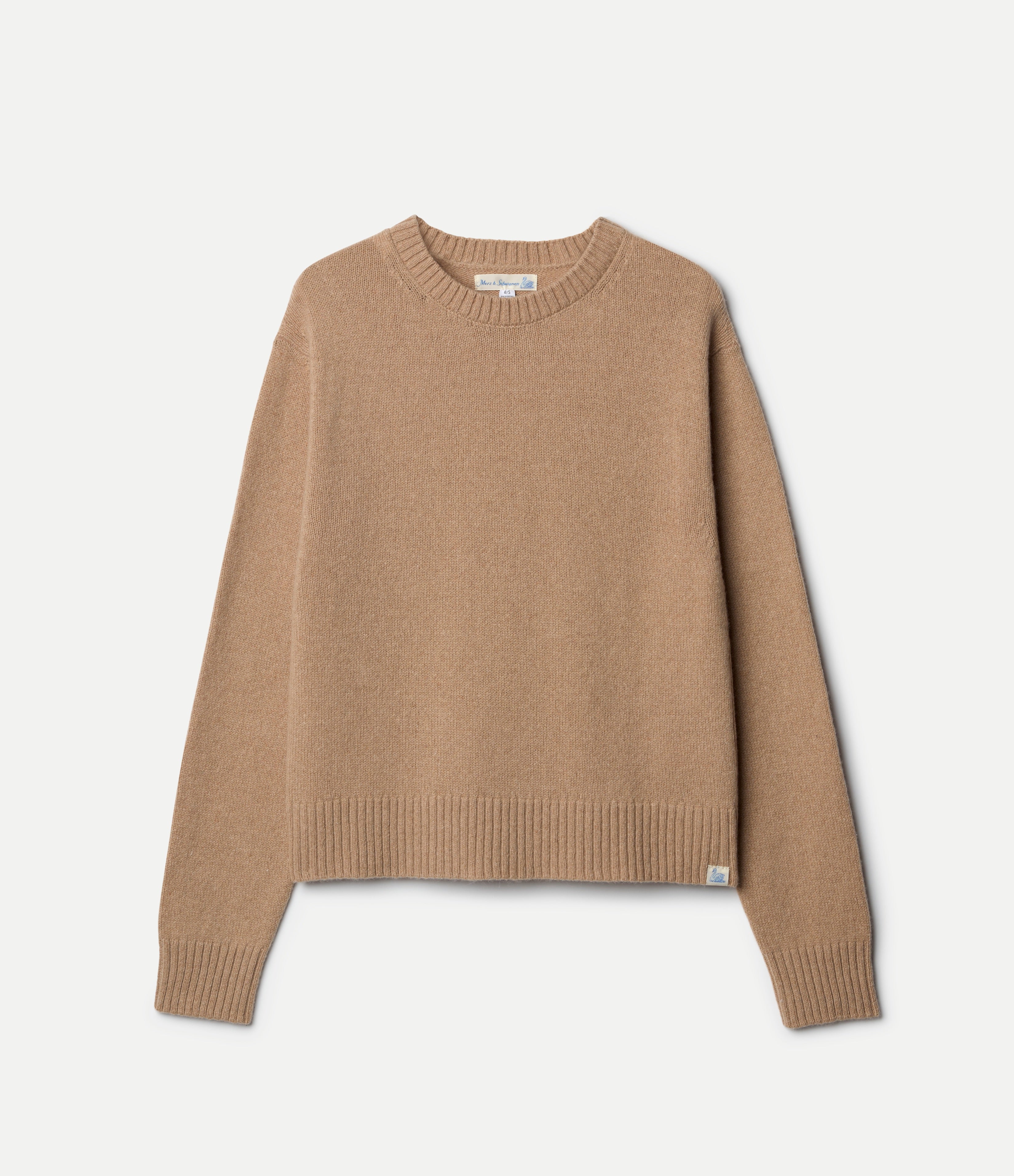 Beige cashmere sweater on a light gray background