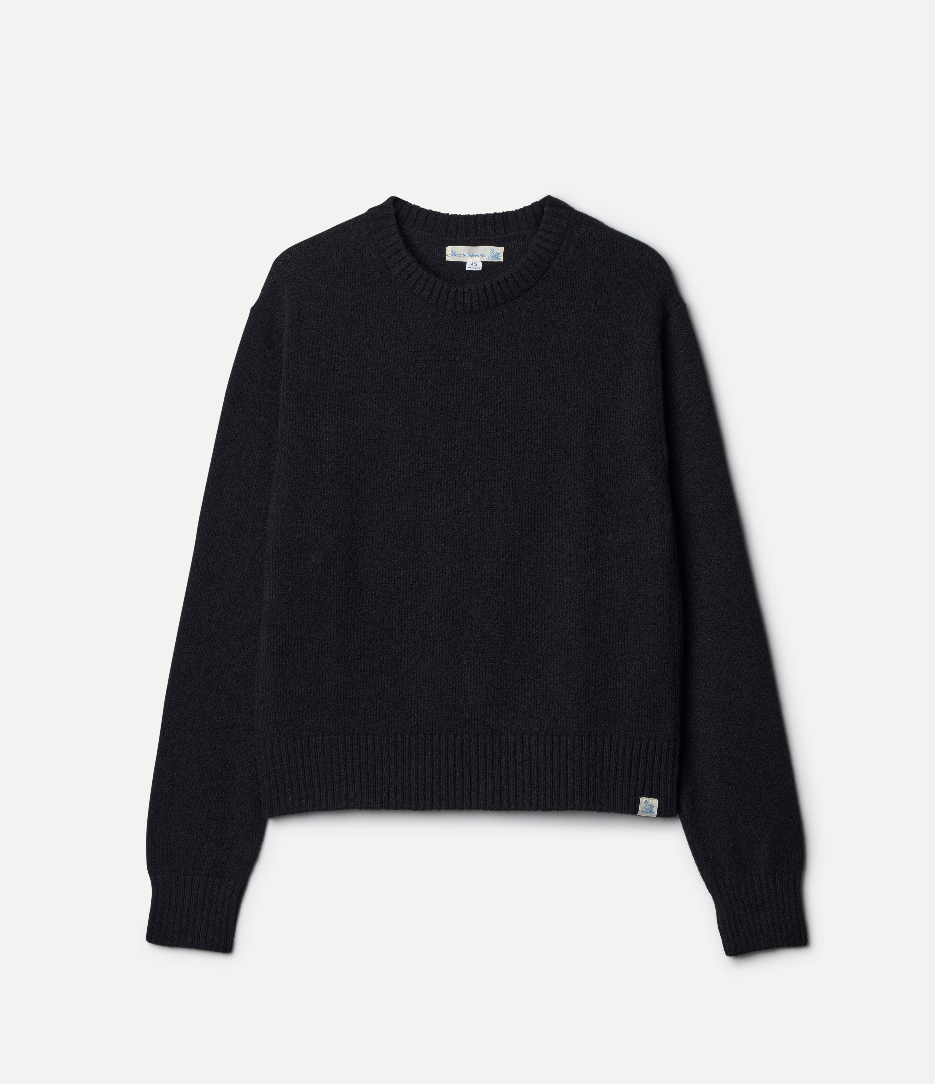 Black cashmere sweater on a light gray background