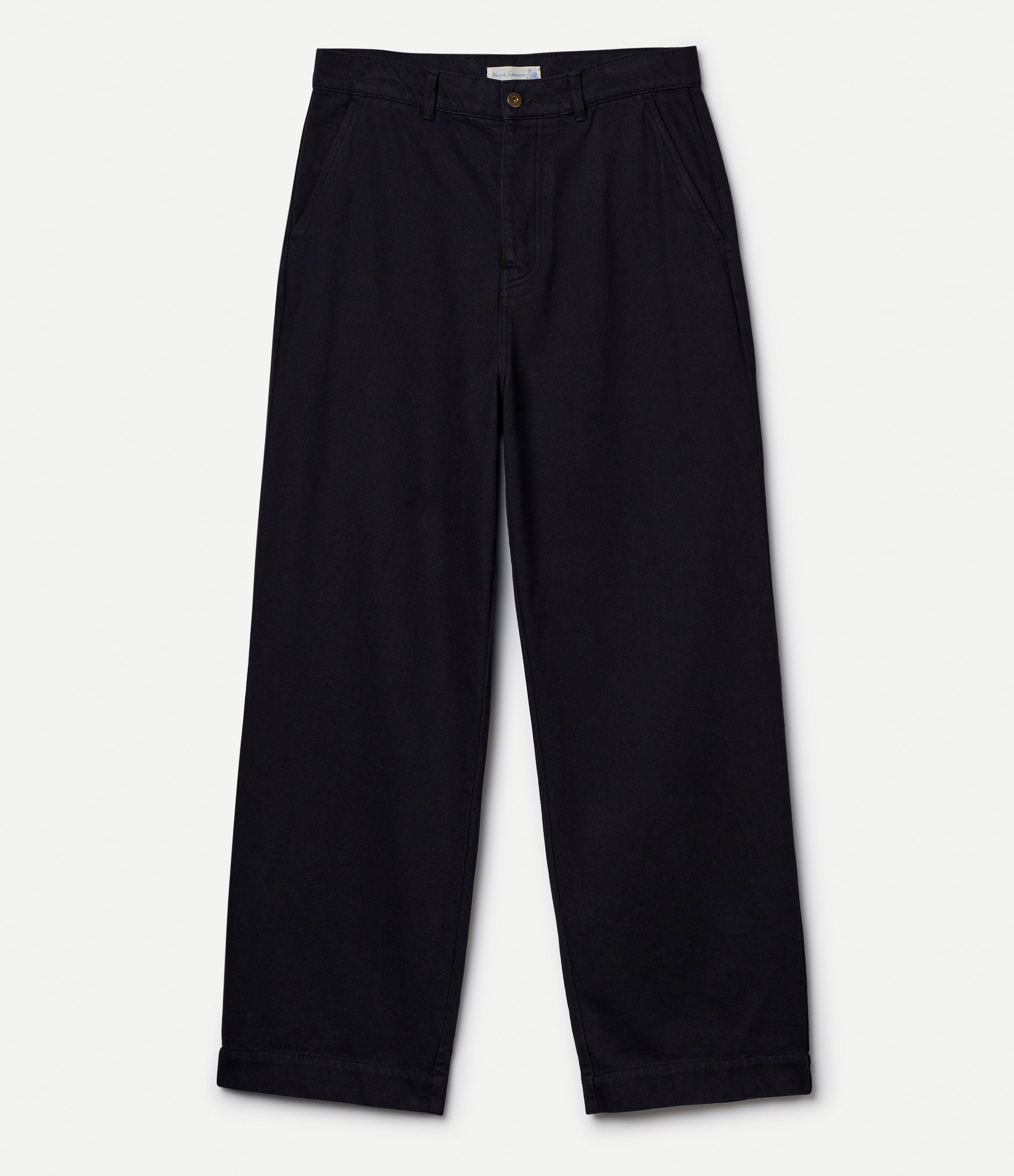 Black cotton twill pants against neutral background