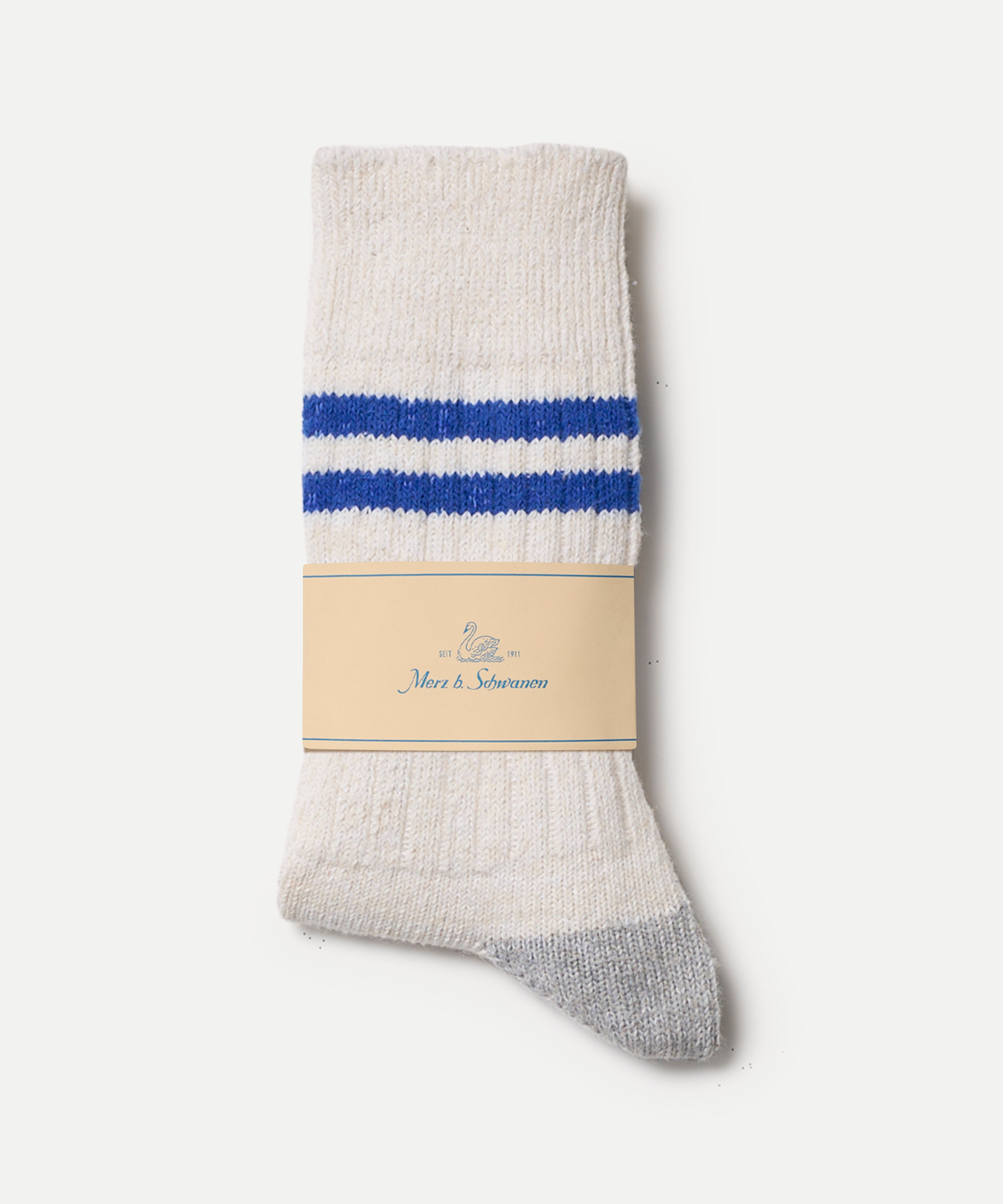 White sock with blue stripes and a visible Merz b. Schwanen label on a white background