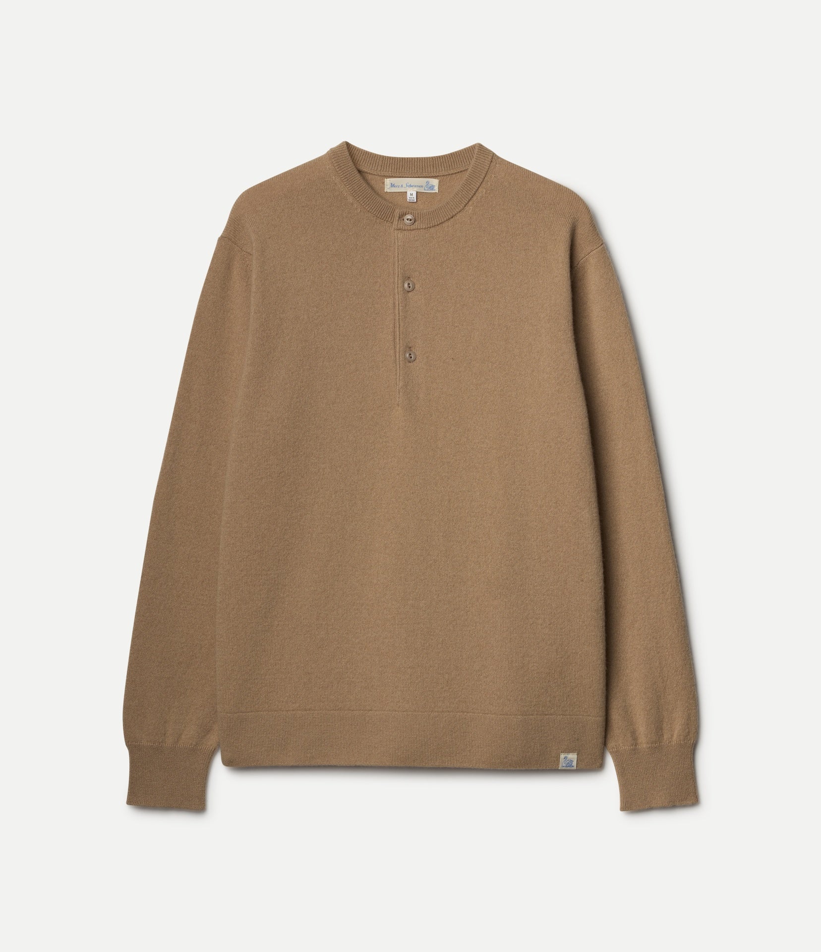 A long-sleeve henley-style knit top in a warm camel brown color, featuring a three-button placket and ribbed cuffs and hem, shown flat against a light off-white background.