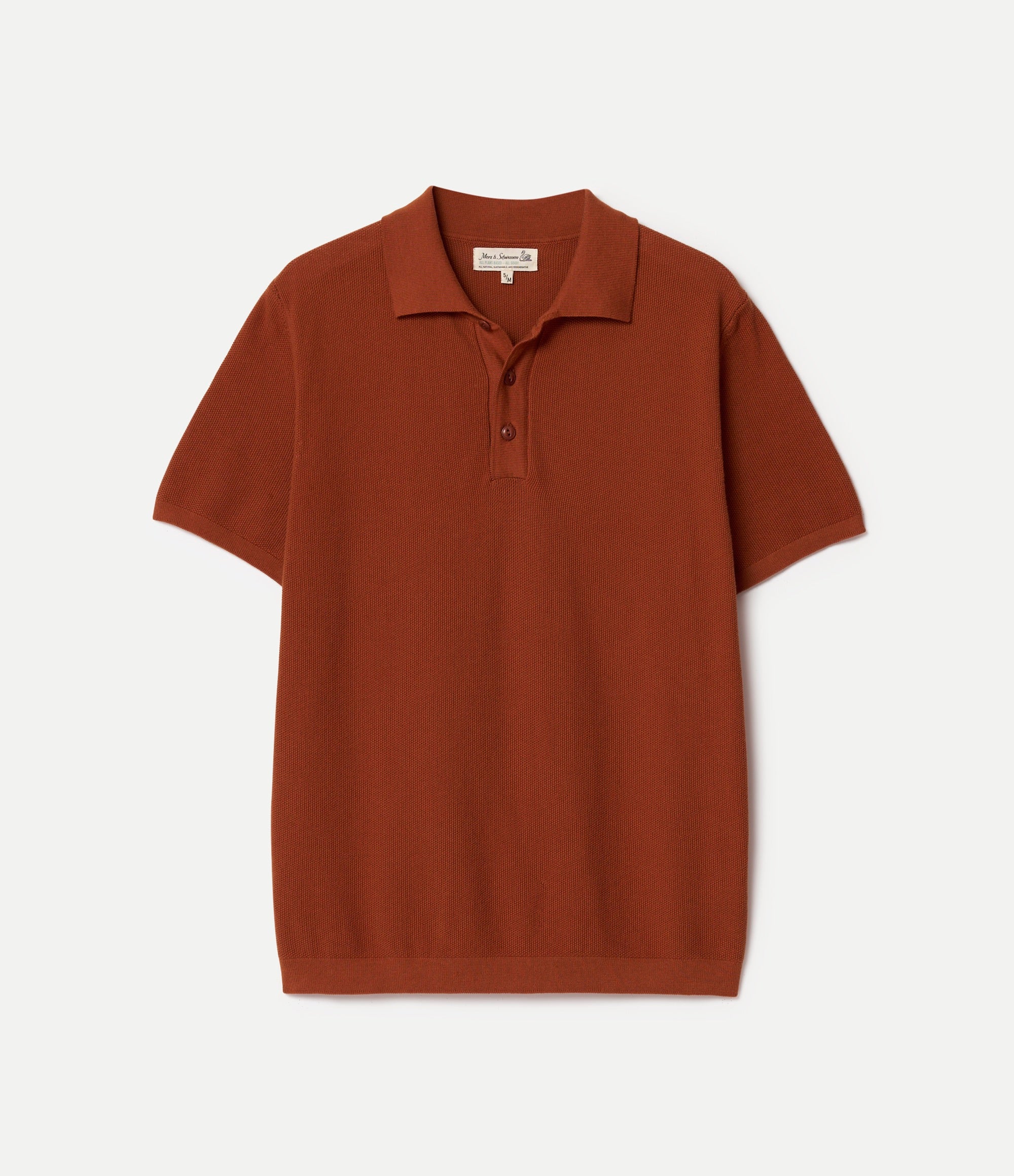 Brown knitted cotton polo shirt on a light beige background
