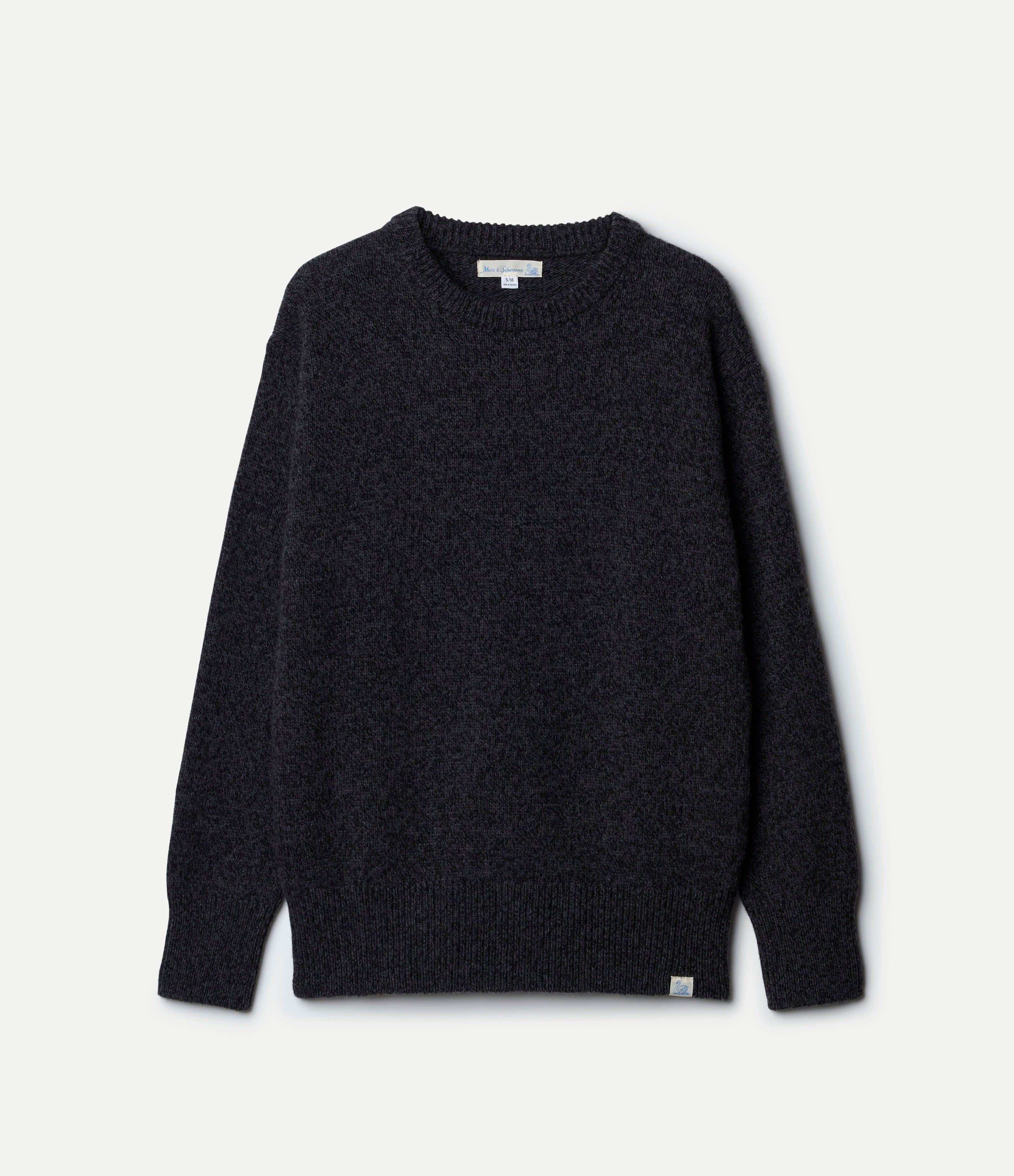 Dark gray sweater on a light gray background
