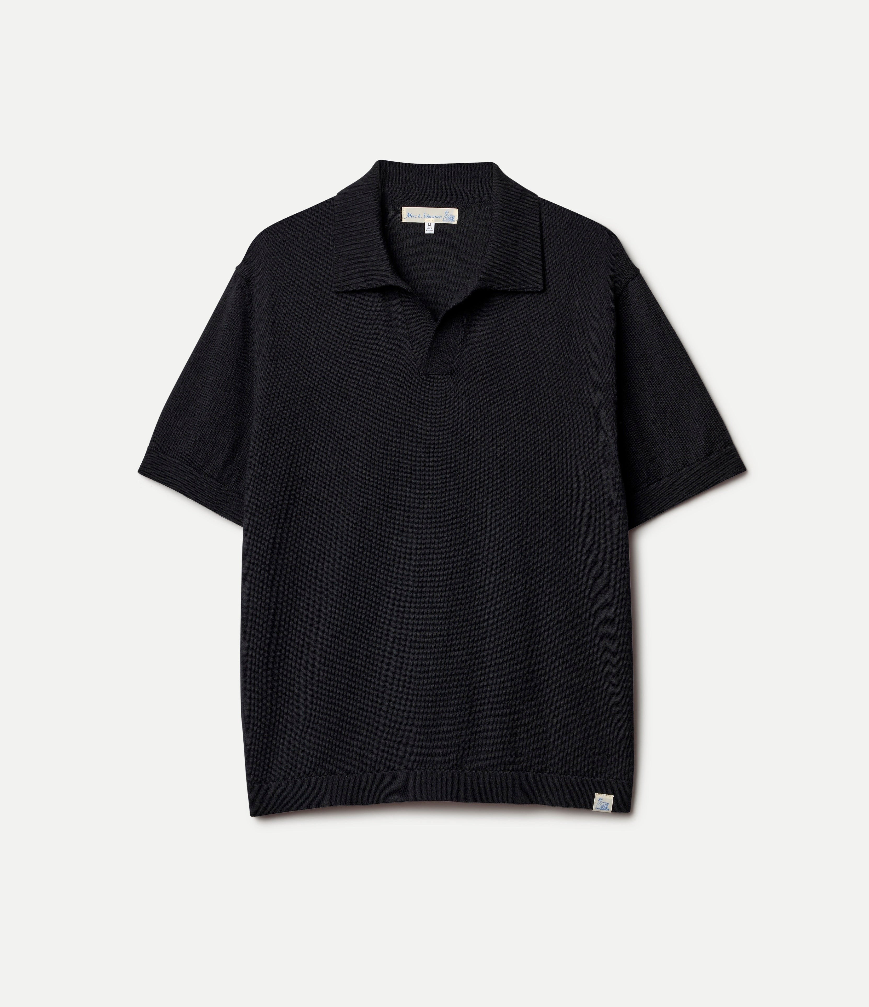 Black knitted merino wool polo shirt on a light gray background