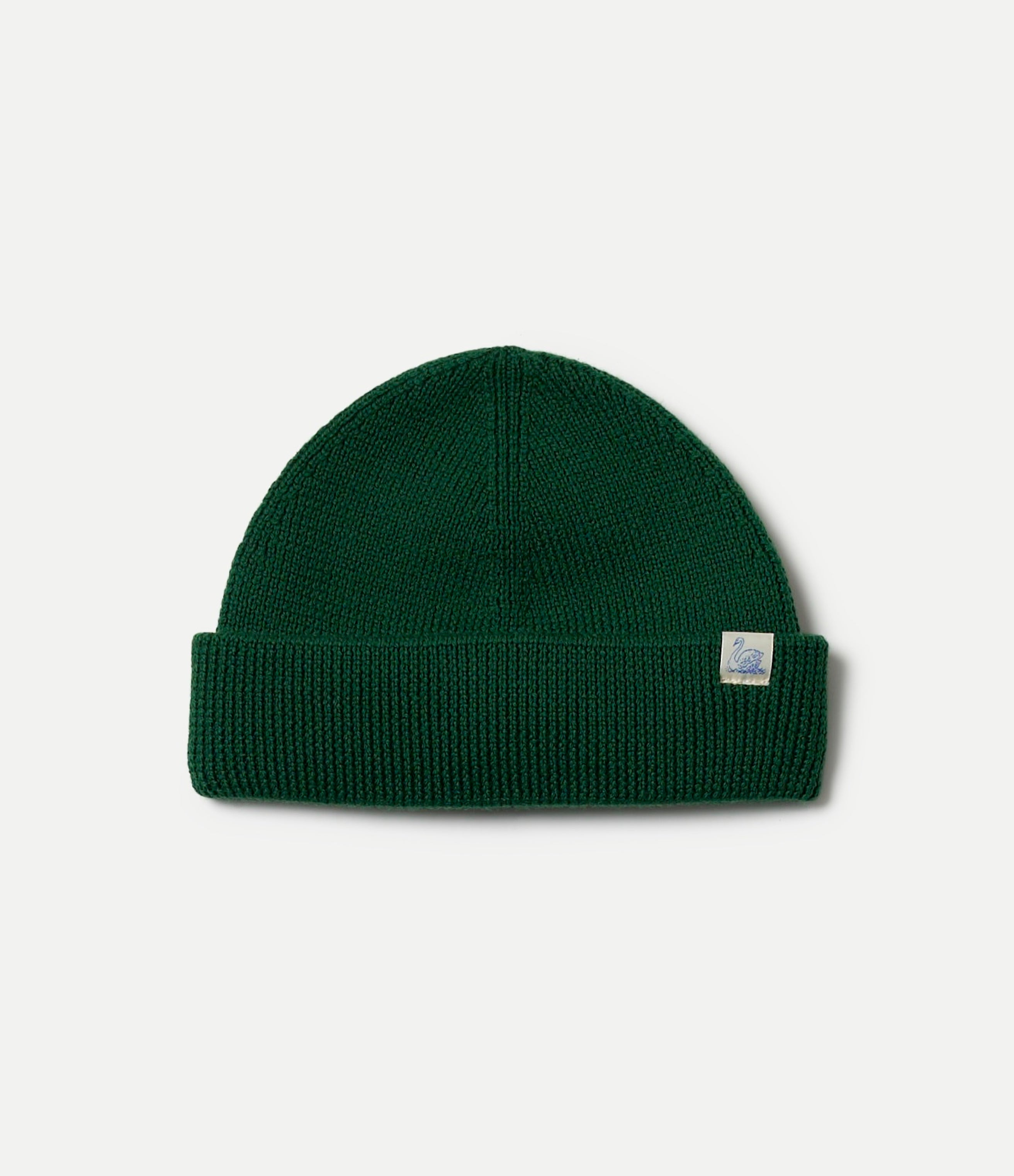 Green beanie with a Swan brand logo on a light gray background