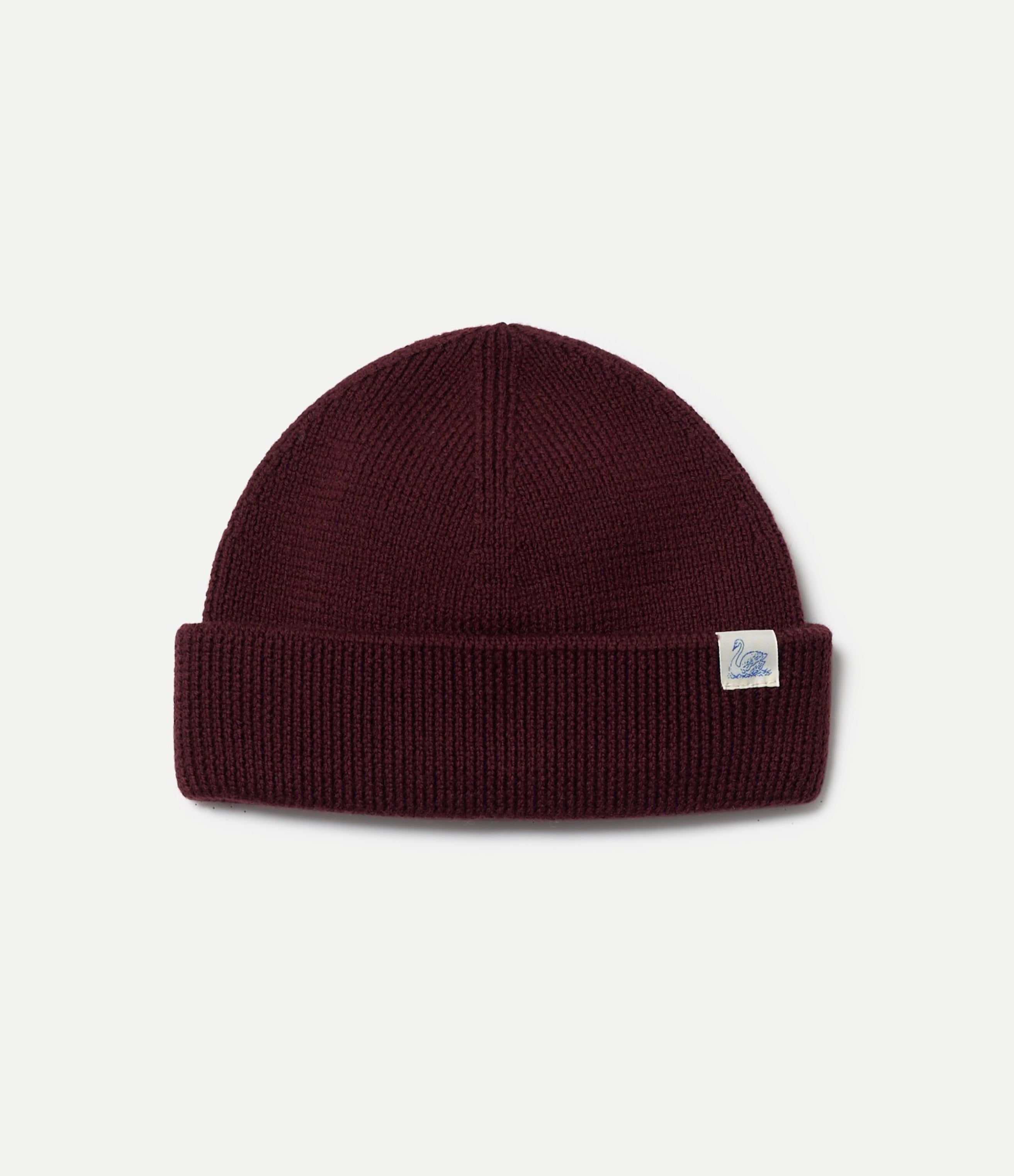 Maroon beanie with a small logo on a light gray background