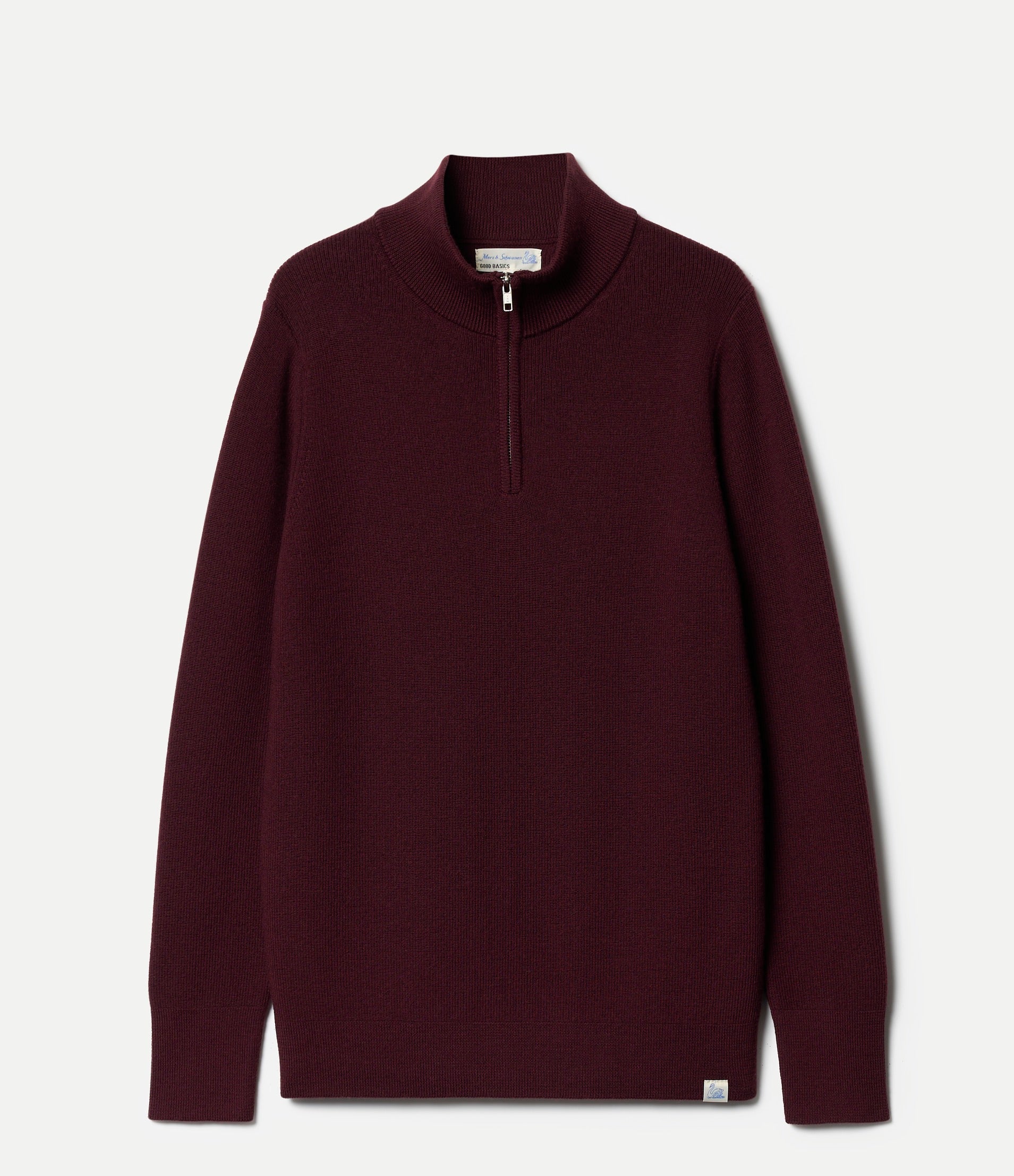 Maroon sweater with a quarter zip on a light gray background