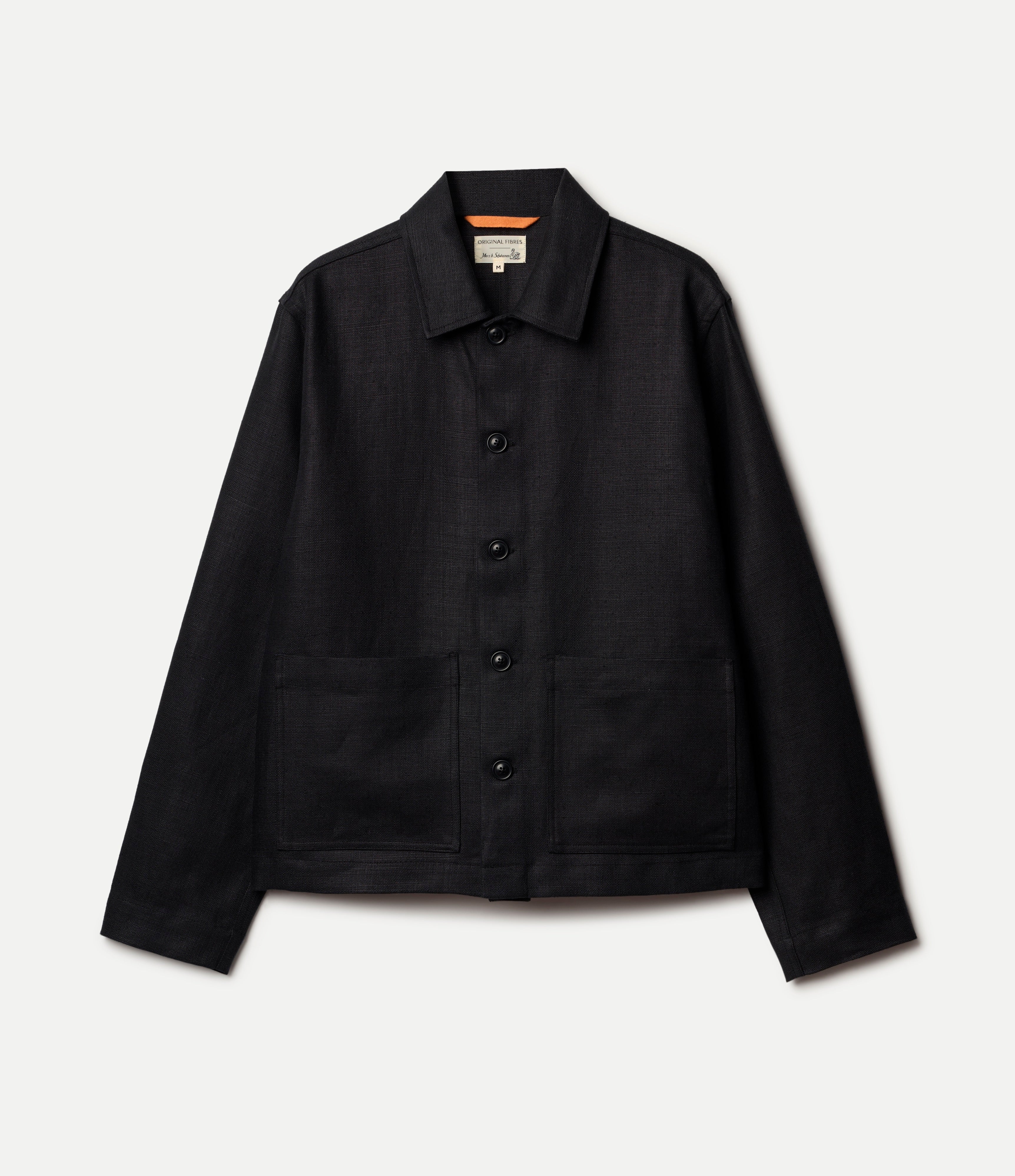 Black linen jacket on a light gray background