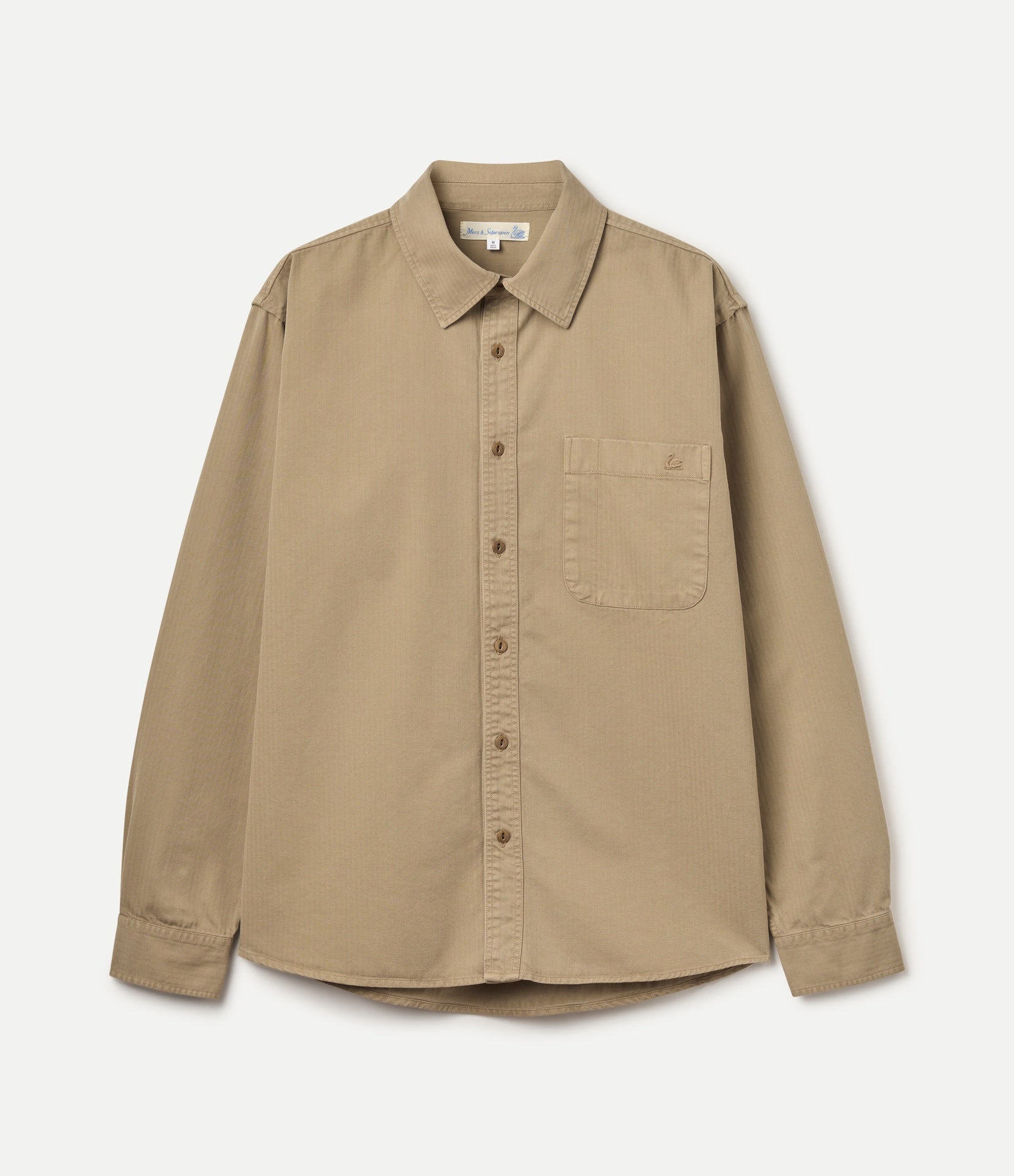 A long-sleeve button-up shirt in a warm khaki color, featuring a classic collar, button-down front, and a single chest pocket, shown against a light off-white background.