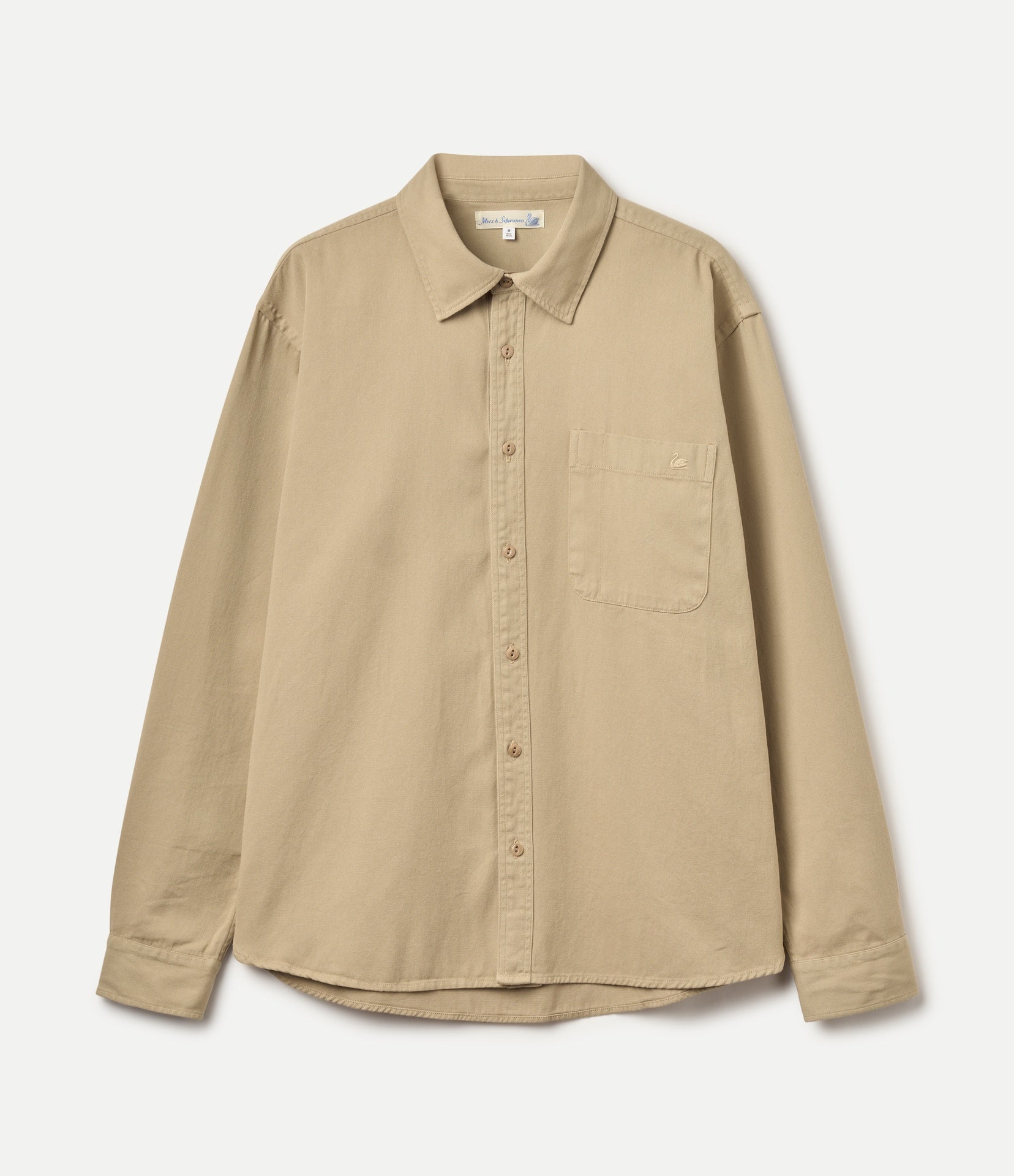 A beige long-sleeve button-up shirt with a single chest pocket, laid flat against a light off-white background.