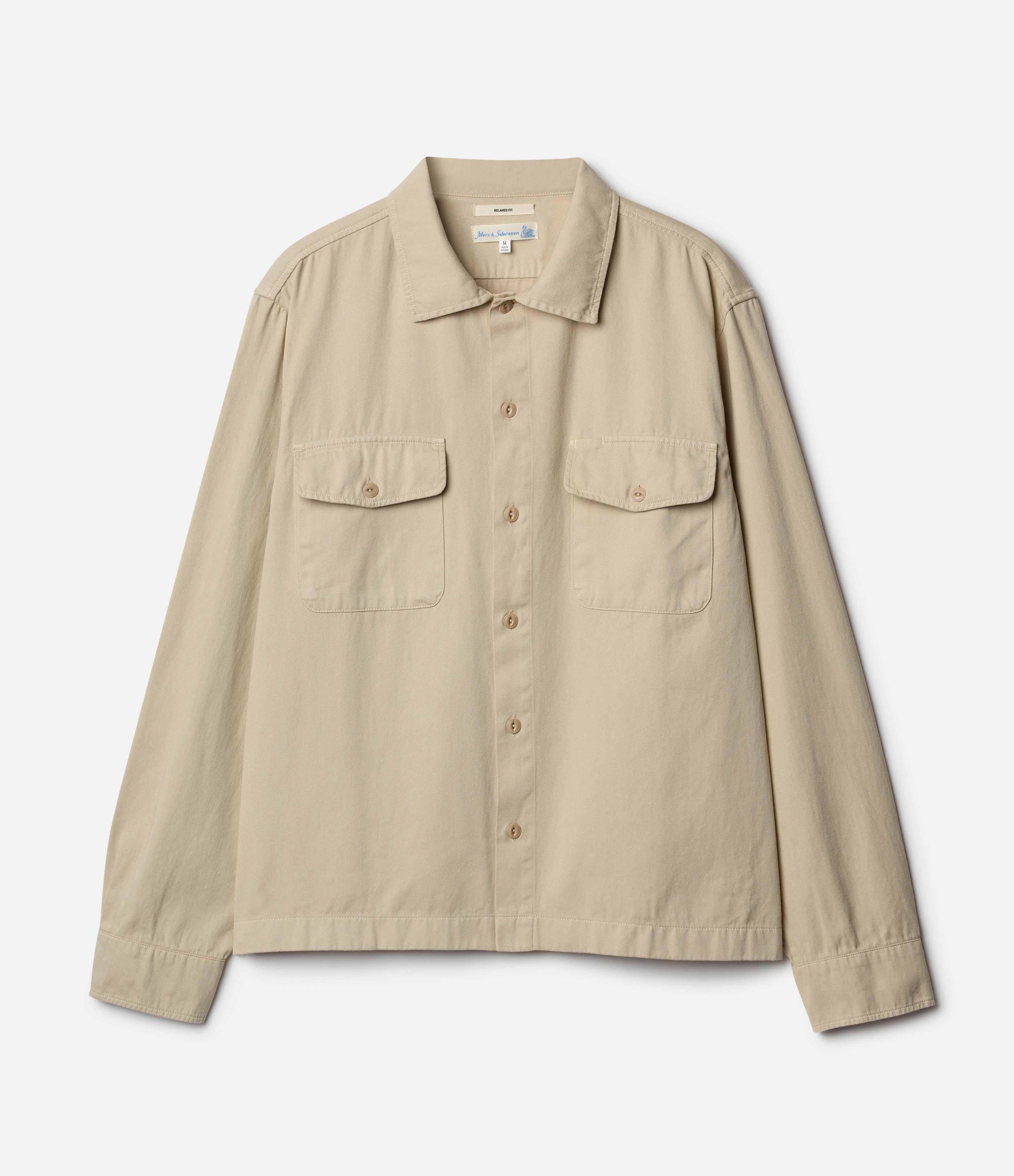 Beige cotton twill shirt against neutral background