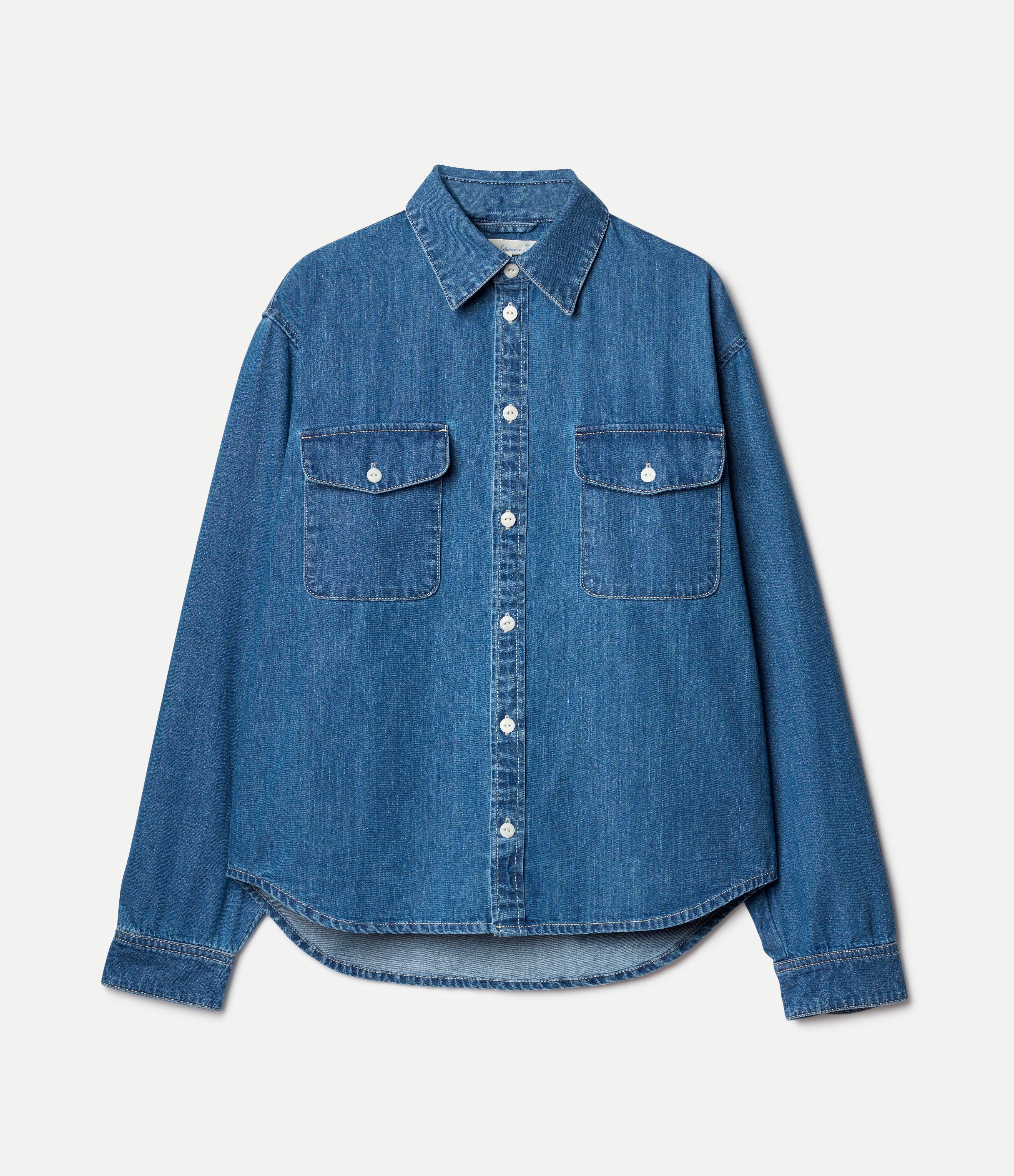 Blue denim shirt on a light gray background