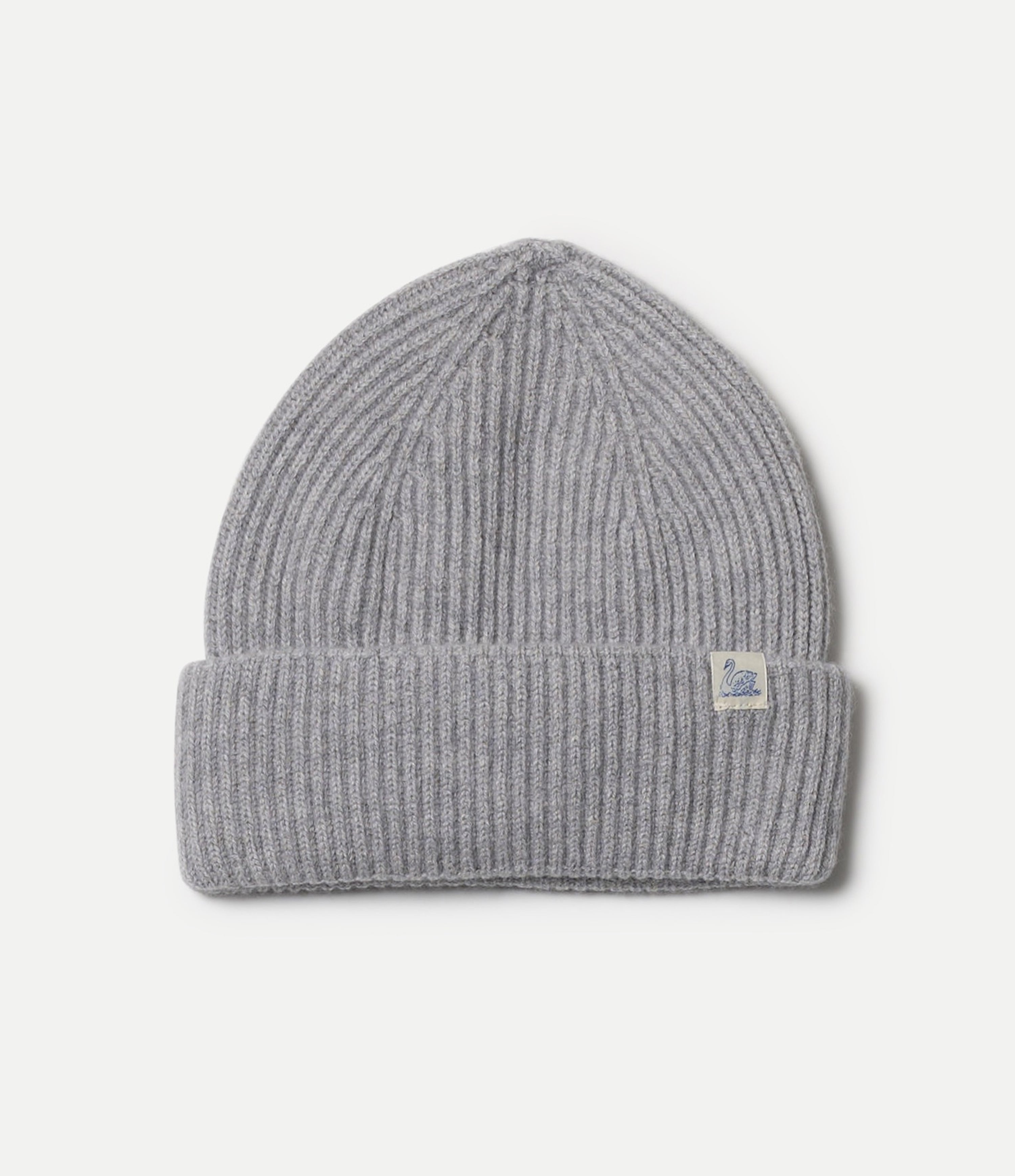 Gray knit beanie with a brand label on a light gray background