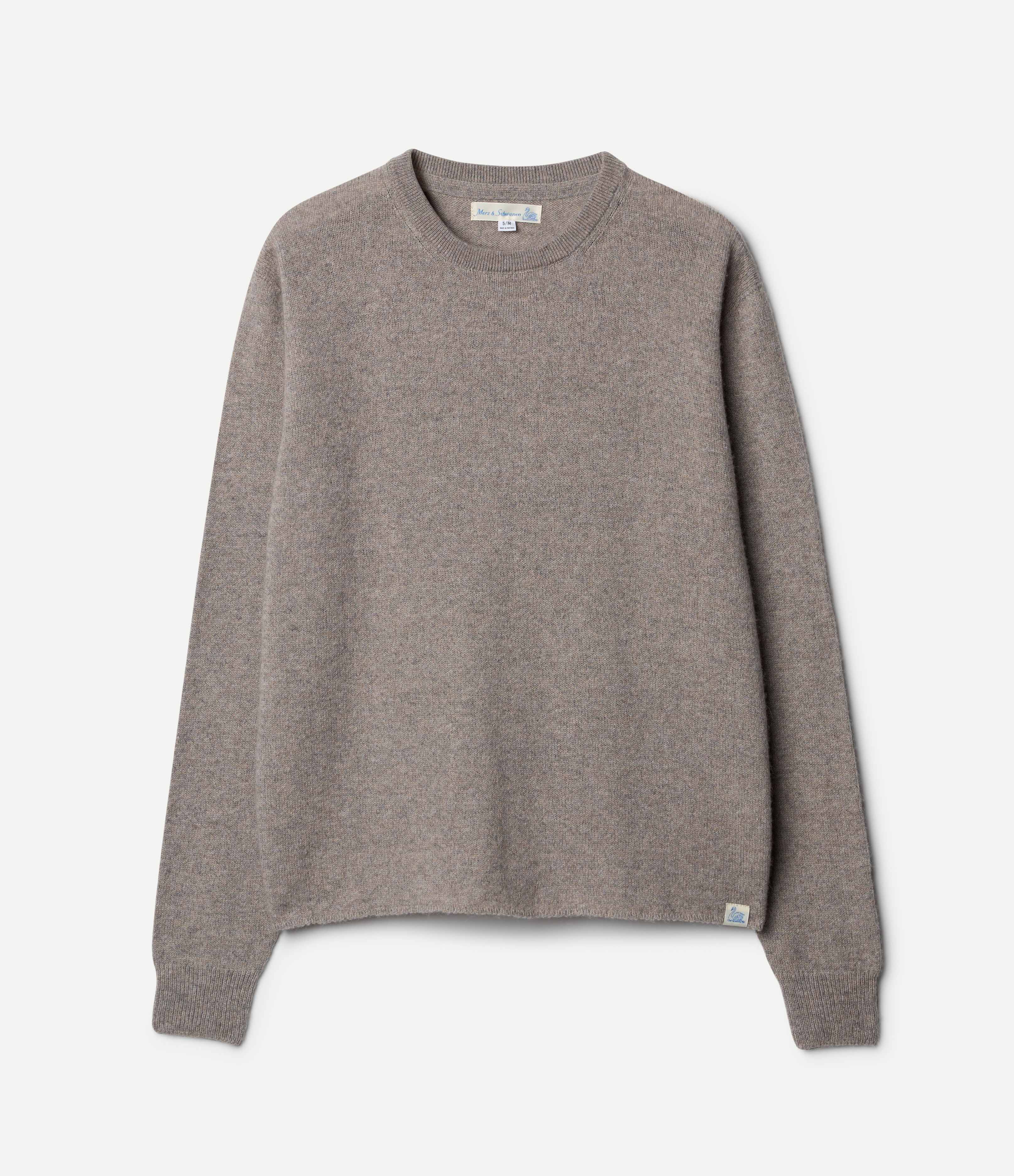 A grey, long-sleeved, extra-fine merino wool-cashmere-silk sweater against a white background.
