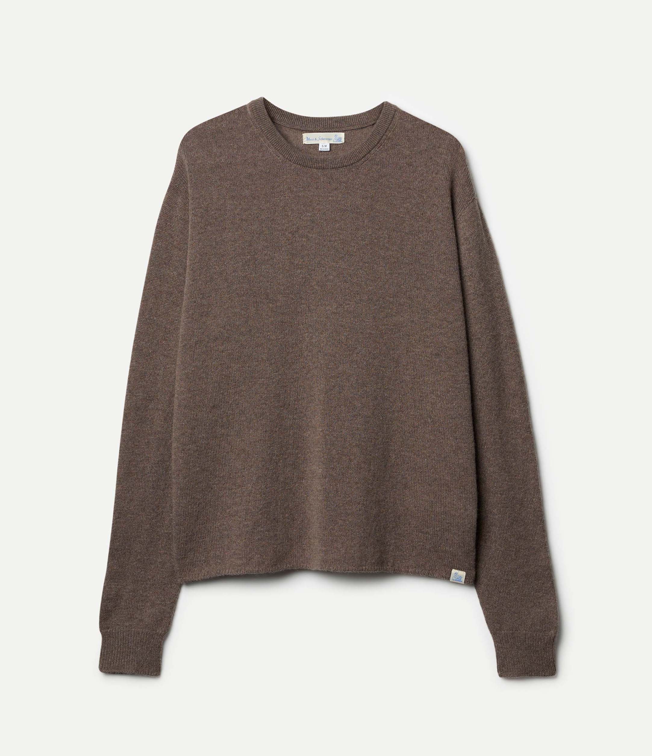 A grey, long-sleeved, extra-fine merino wool-cashmere-silk sweater against a white background.