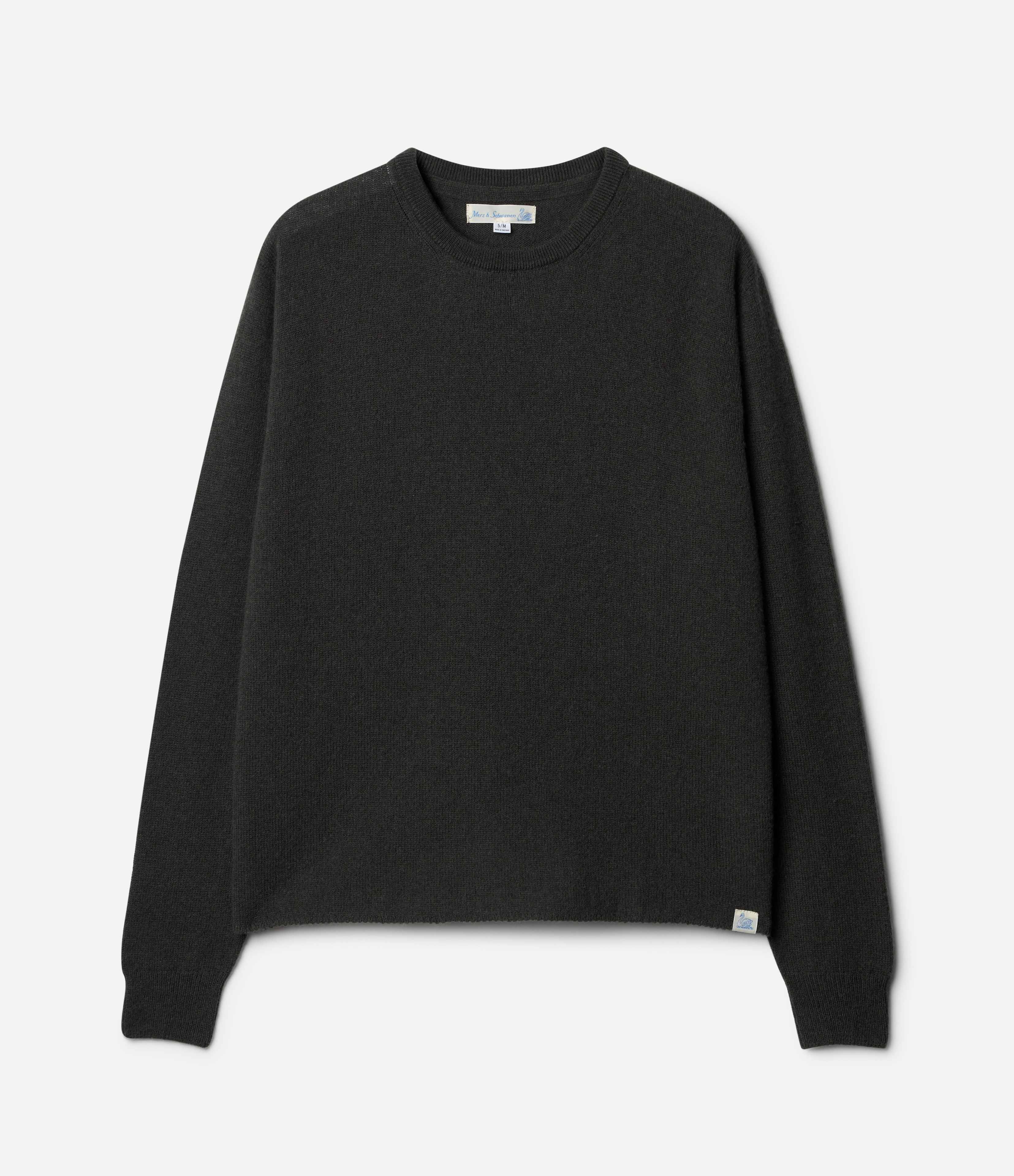 A green, long-sleeved, extra-fine merino wool-cashmere-silk sweater against a white background.