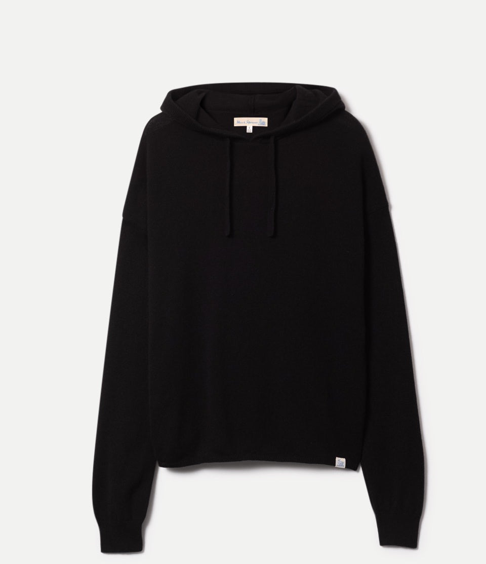 Black knitted hoodie made of merino wool, silk and cashmere against neutral background