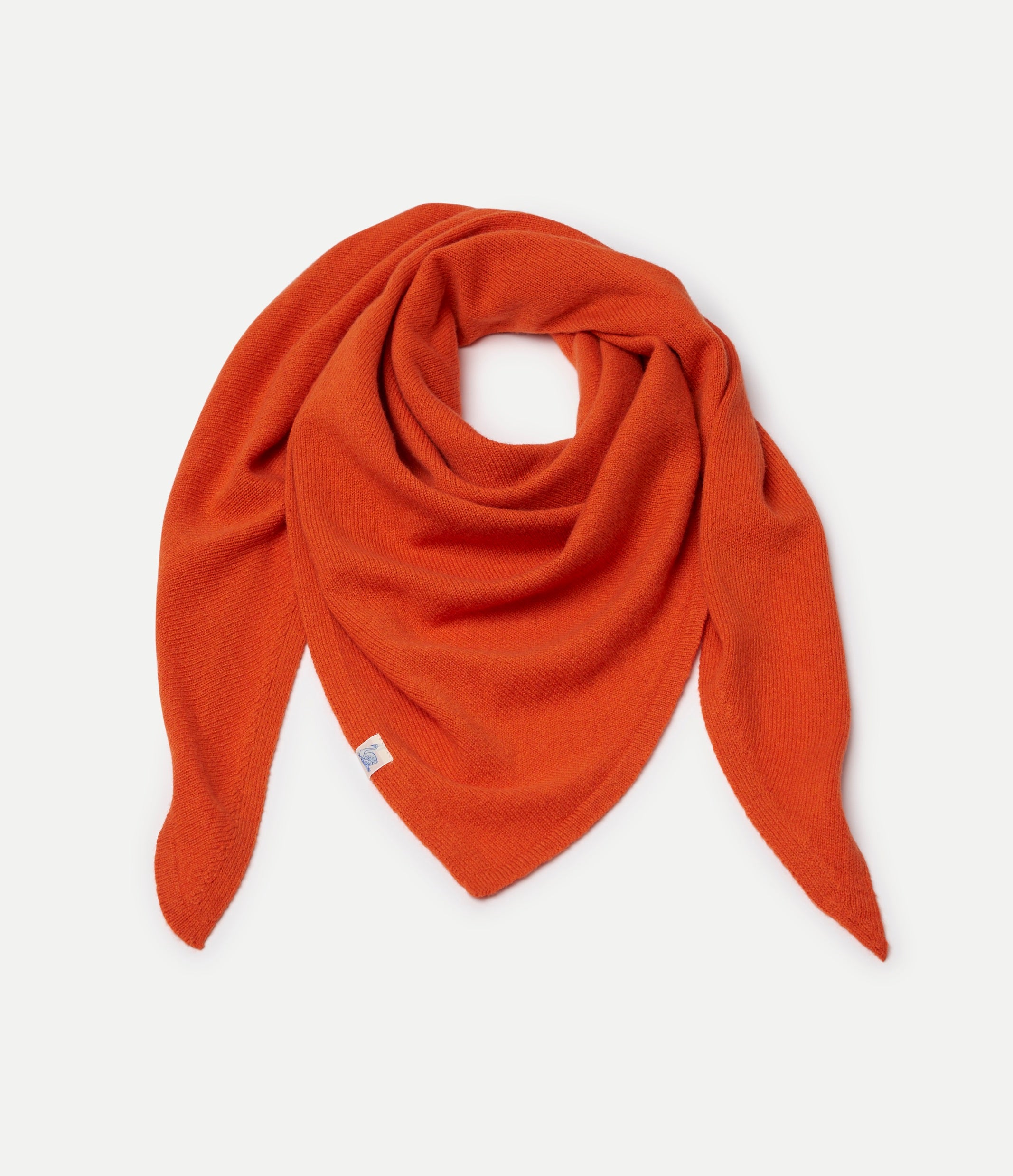 Orange Scarf made of merino wool, silk and cashmere against neutral background