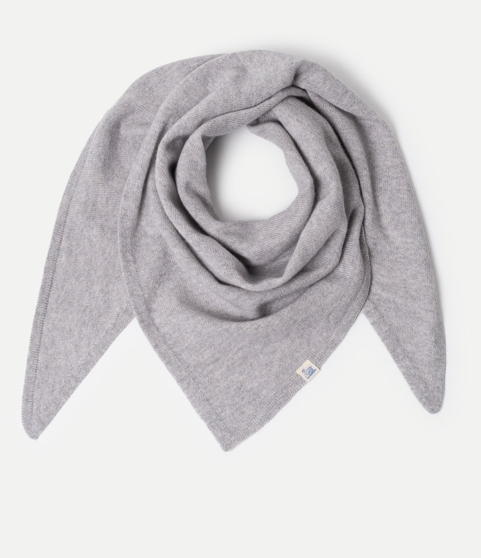 Grey Scarf made of merino wool, silk and cashmere against neutral background