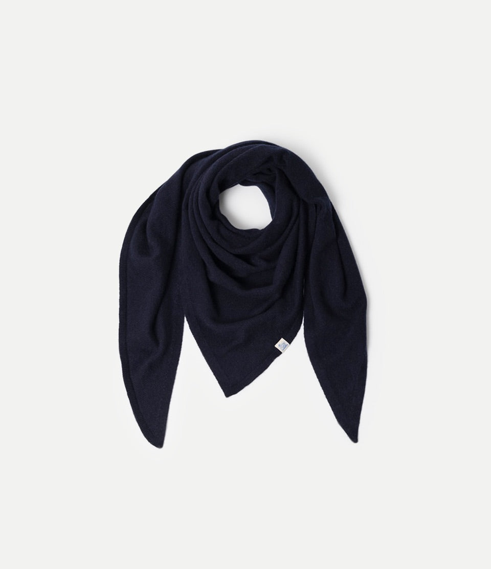 Blue Scarf made of merino wool, silk and cashmere against neutral background