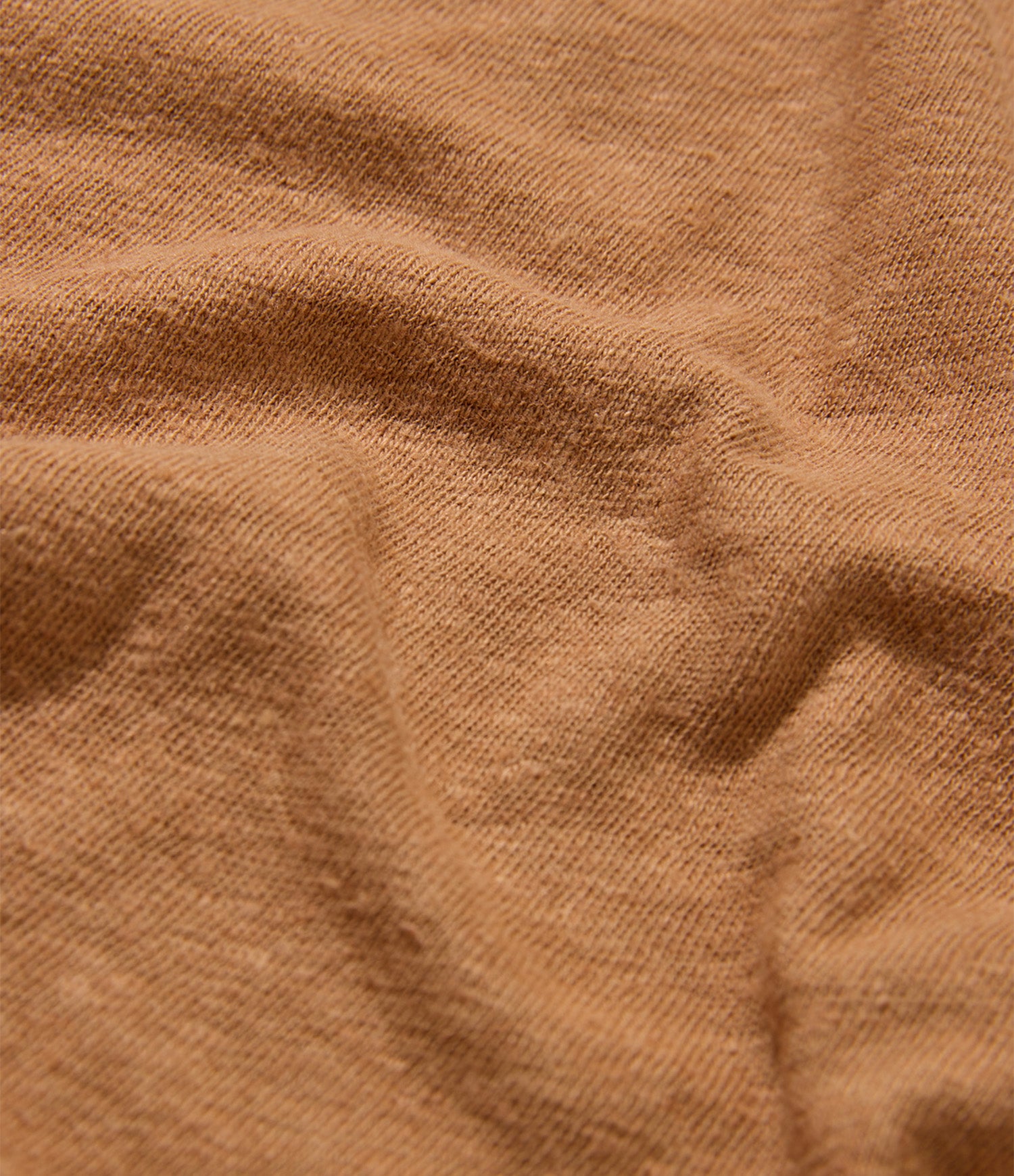 Close-up of brown linen/cotton fabric with visible texture