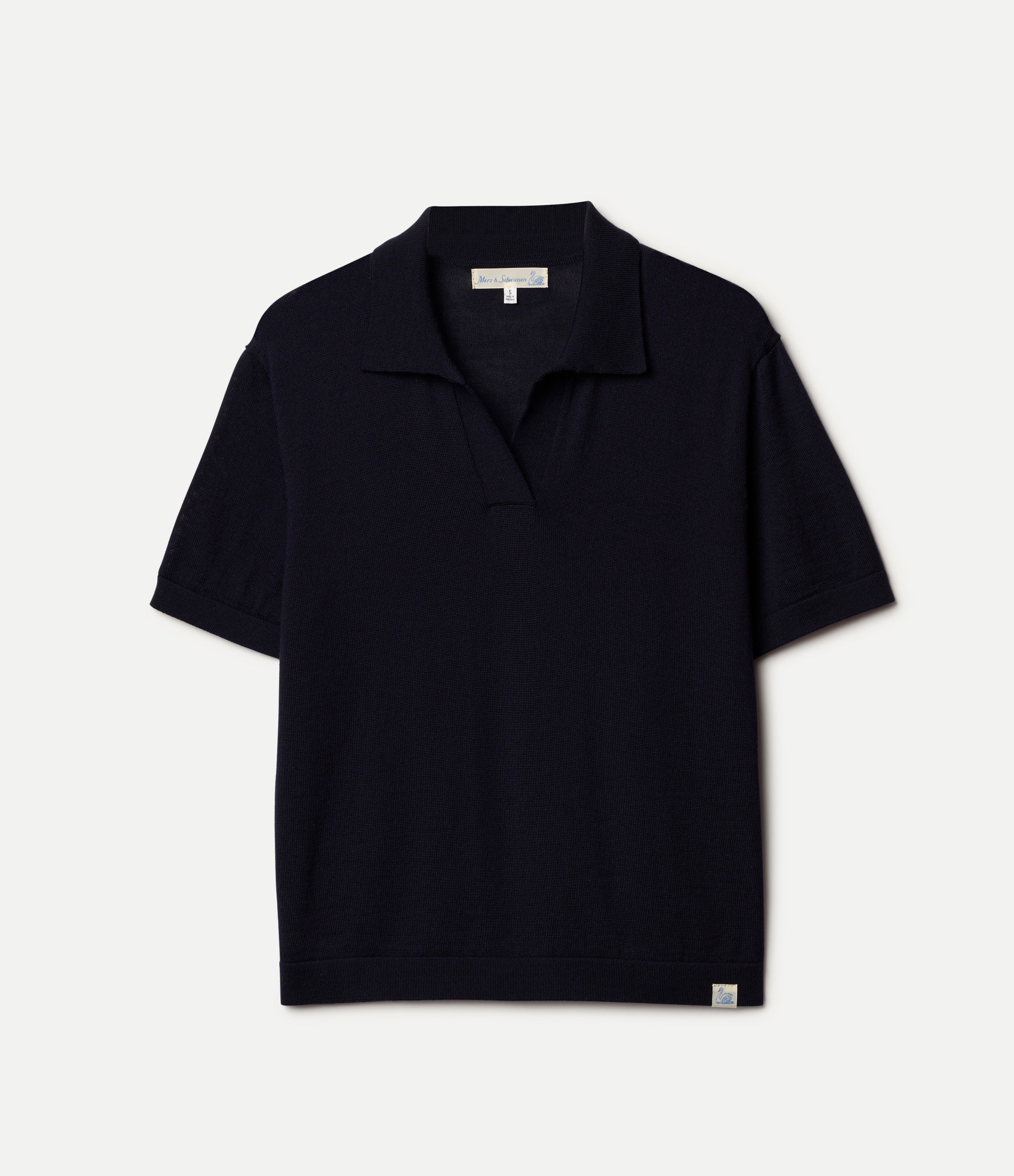 Dark navy knitted merino wool polo shirt on a light gray background