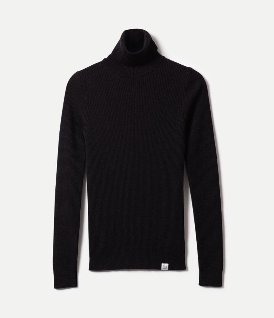 Black turtleneck sweater against neutral background