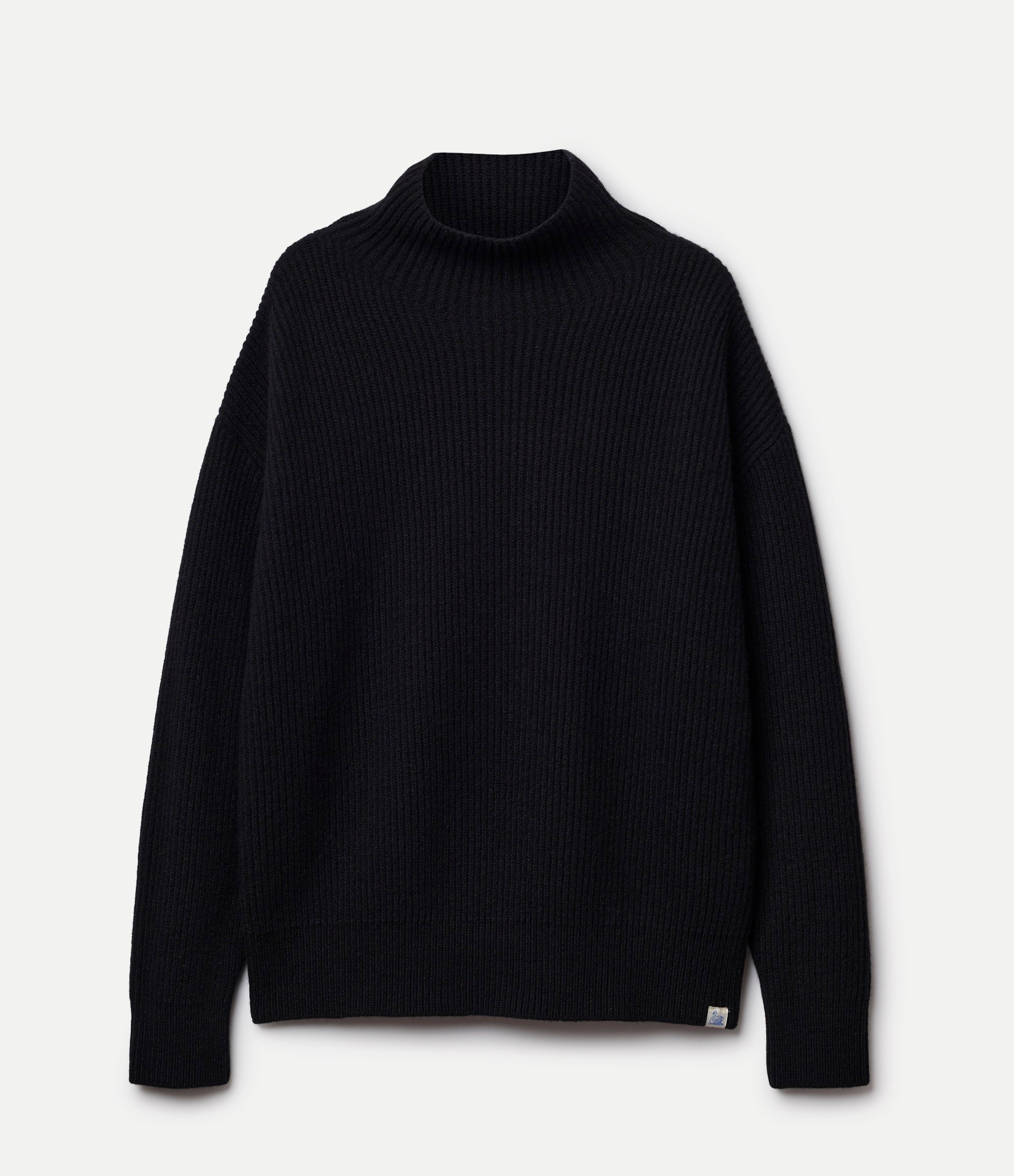 Black turtleneck sweater on a light gray background