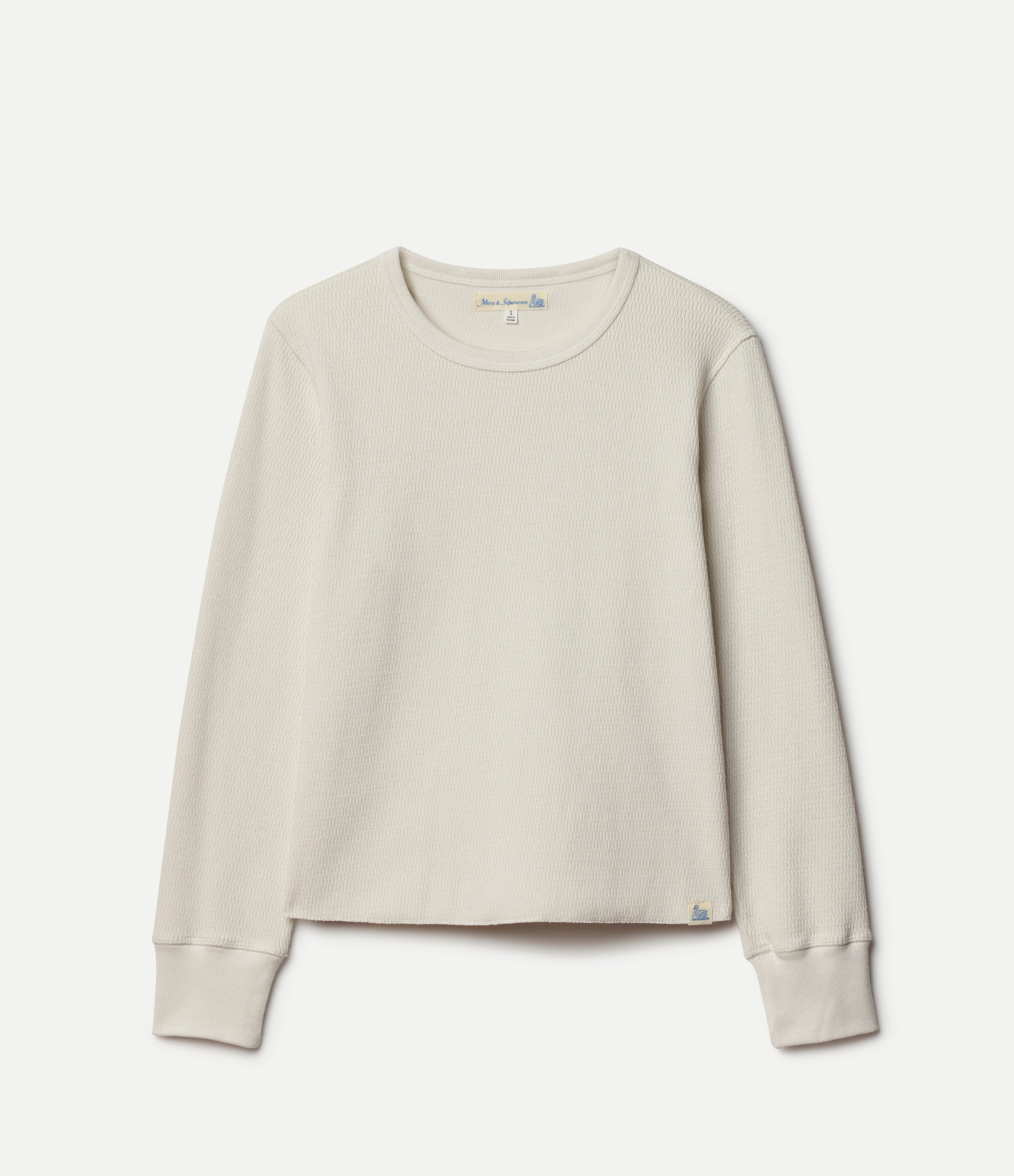 Beige thermal shirt on a light gray background