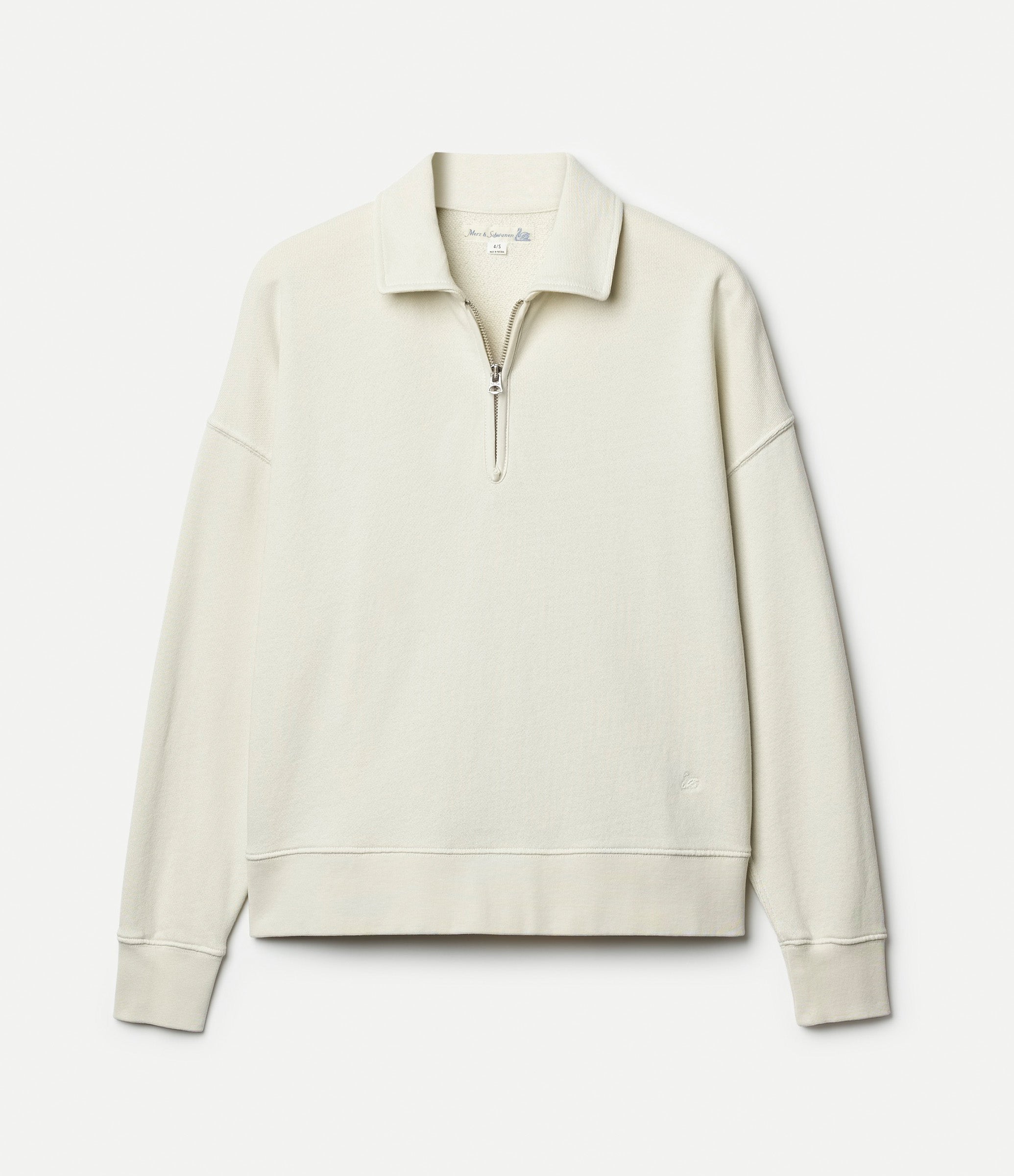 Beige half zip sweatshirt against neutral background