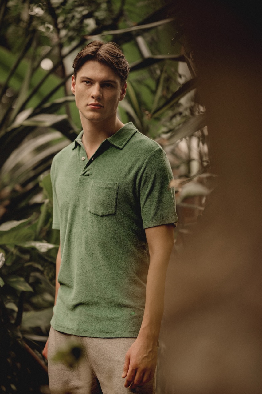 man wearing green Terry polo shirt