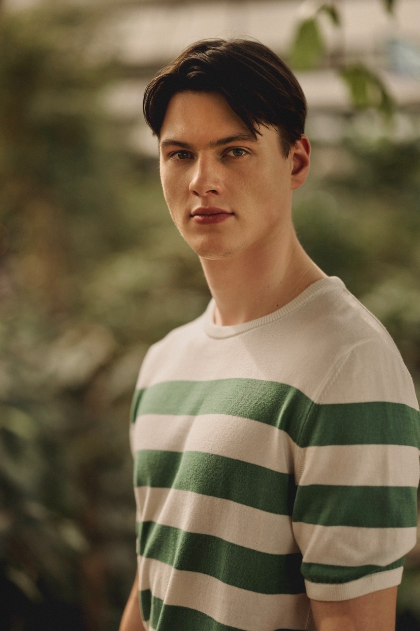 man wearing striped knitted t-shirt